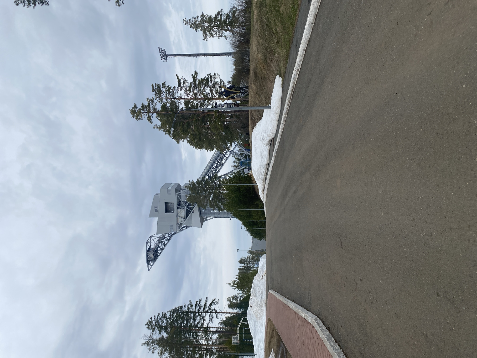 Road with ski jump visible in Прикамский, Russia