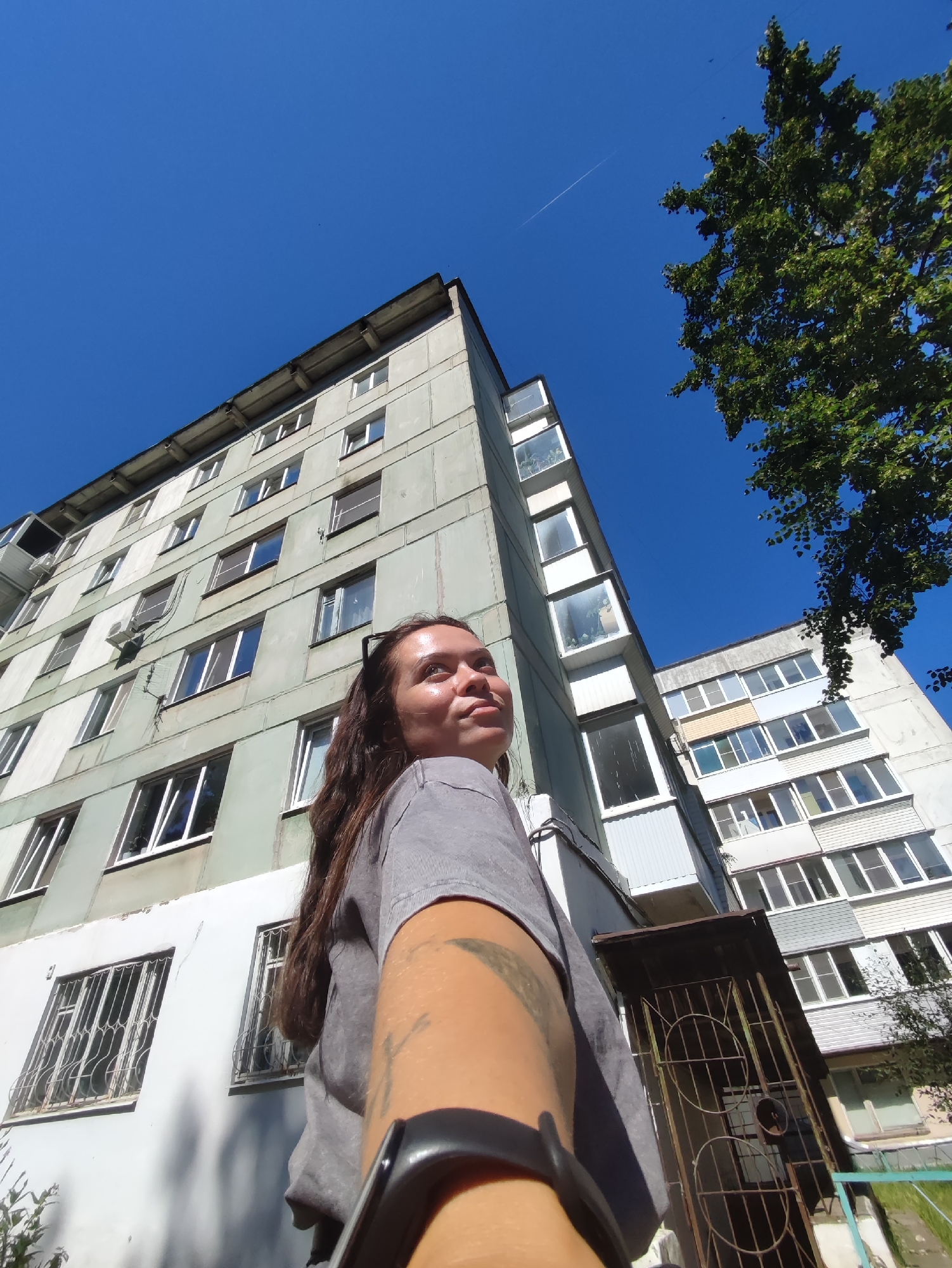 Summer morning near a Soviet apartment block in Chaikovsky