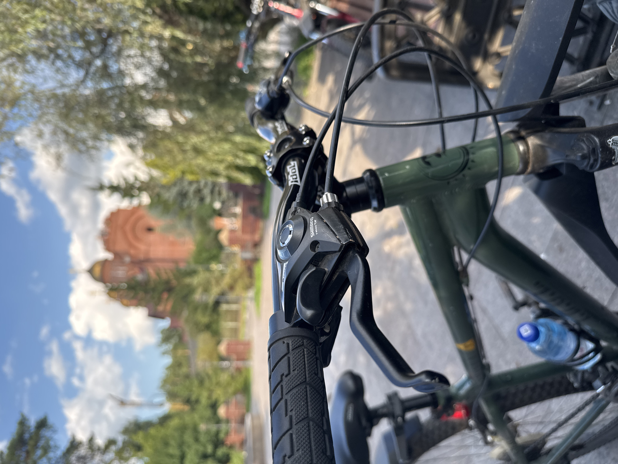 Bike stop at Il'inskiy's Orthodox cathedral on a summer afternoon
