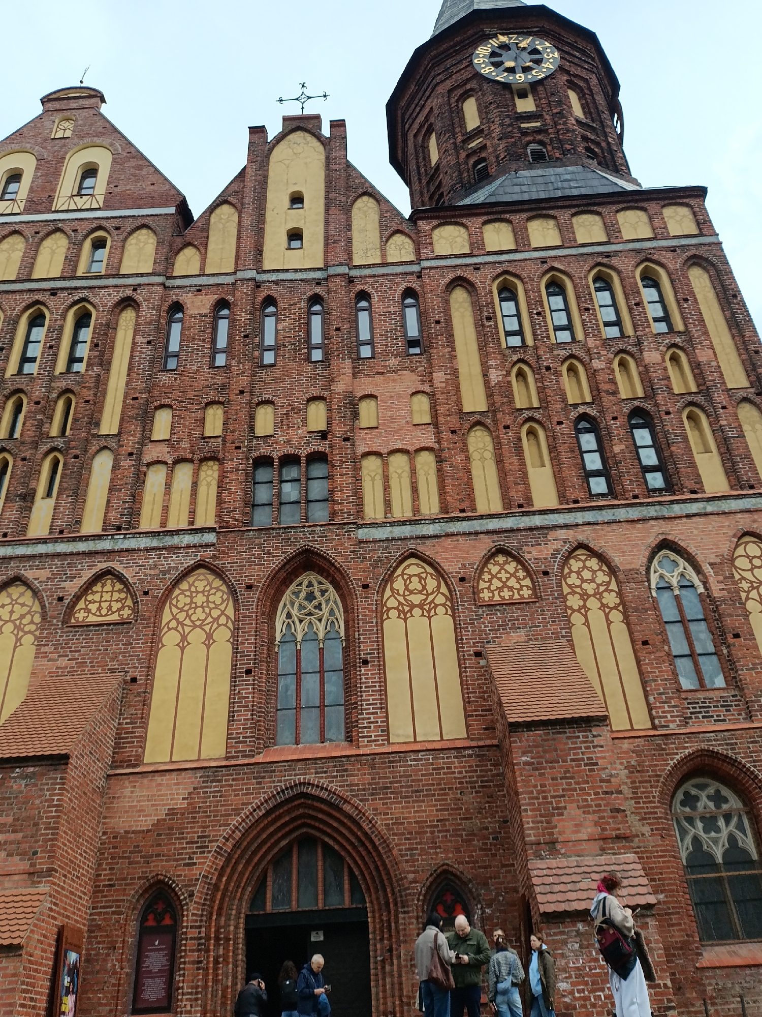 Tourist visits Königsberg Cathedral and Kant statue in Kaliningrad