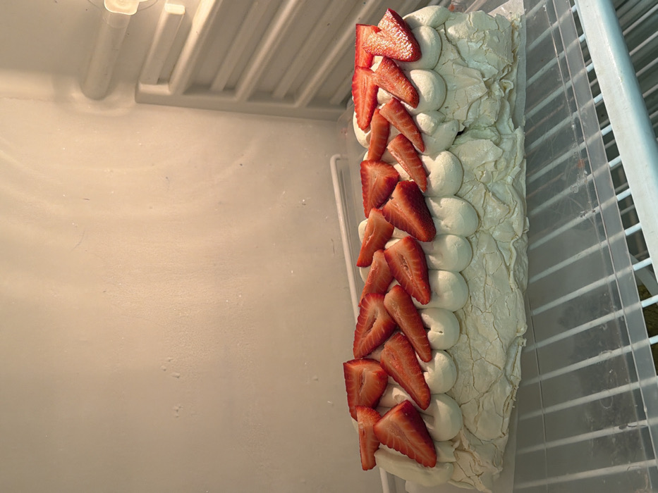 Strawberry meringue roulade prepared and served in Tel Aviv kitchen