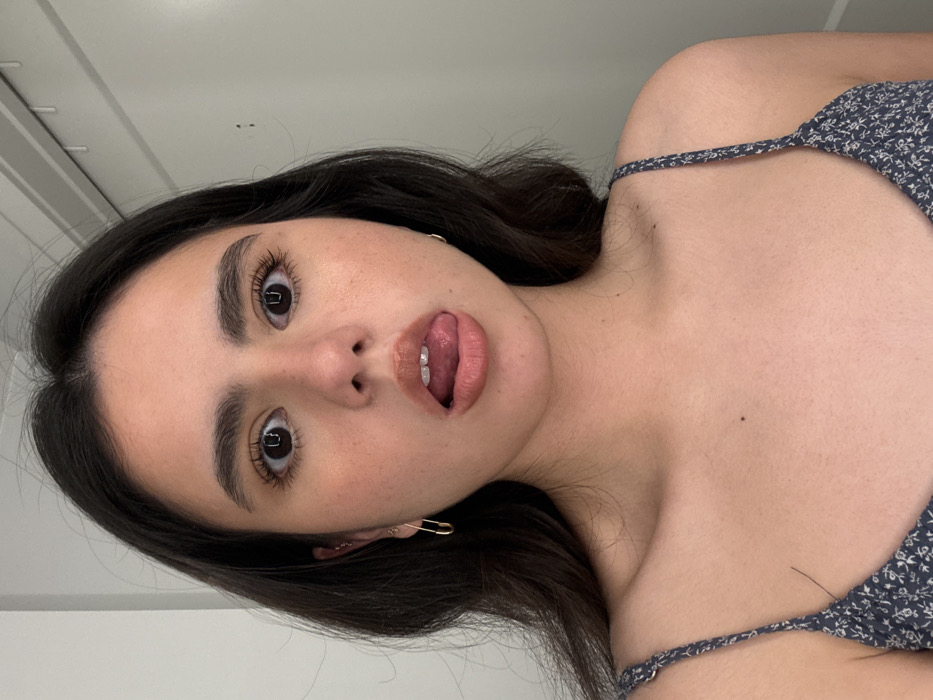 Woman takes bathroom mirror selfies during late-night Austin session