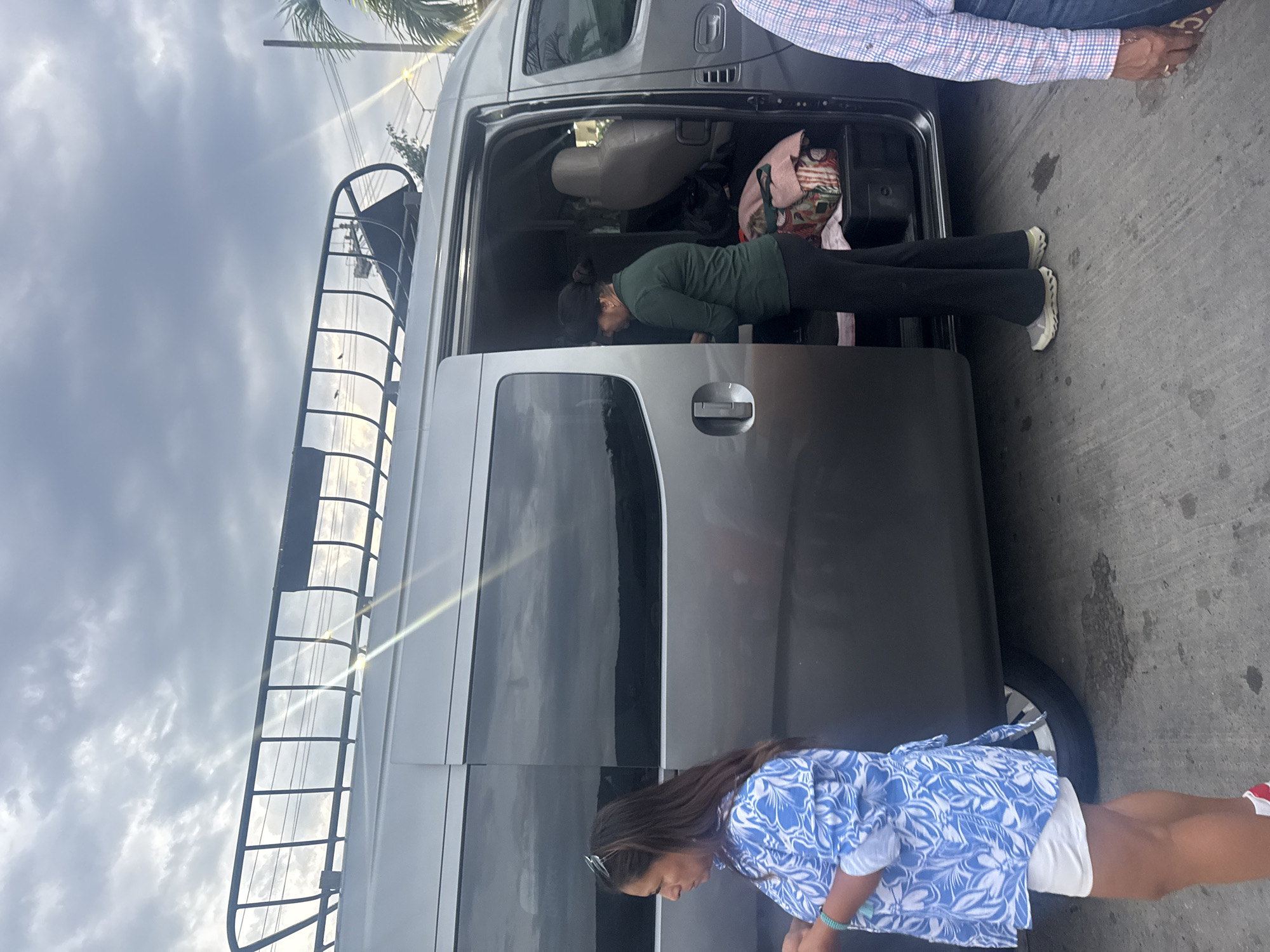 People gather around van in Acapulco midday