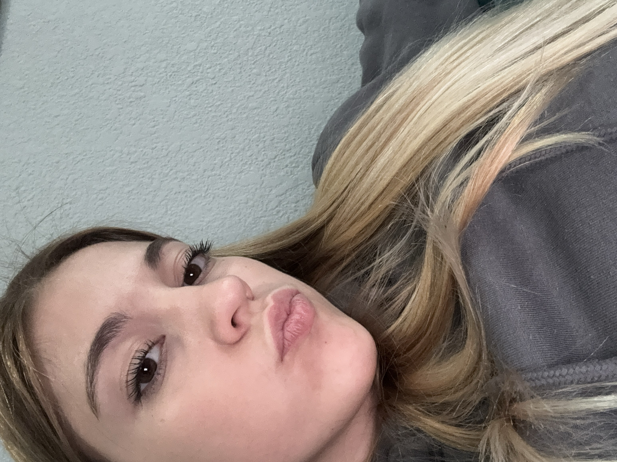 Woman photographed relaxing on sofa in Sofia home