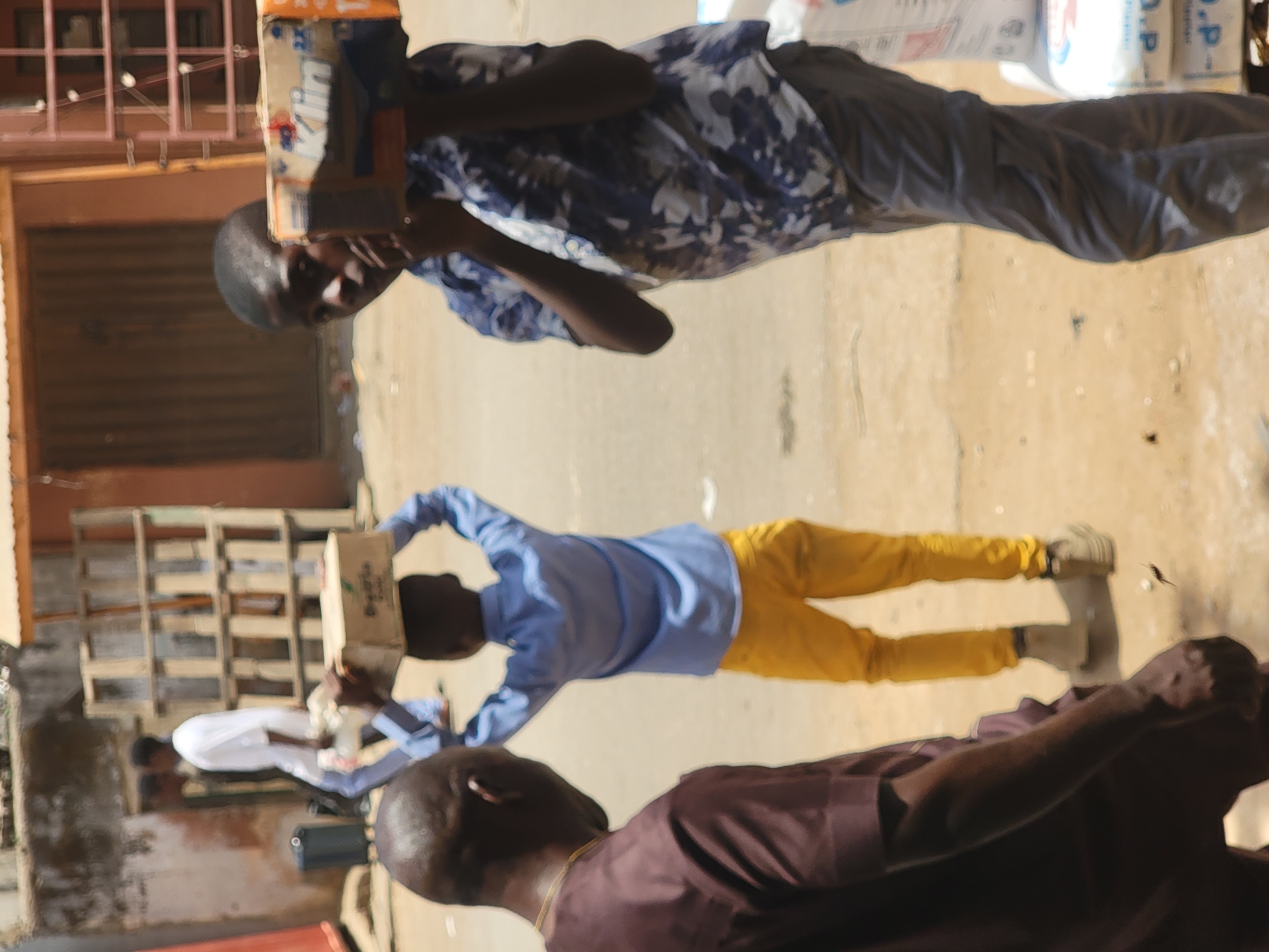 Men carrying goods observed in Maiburiji, Nigeria