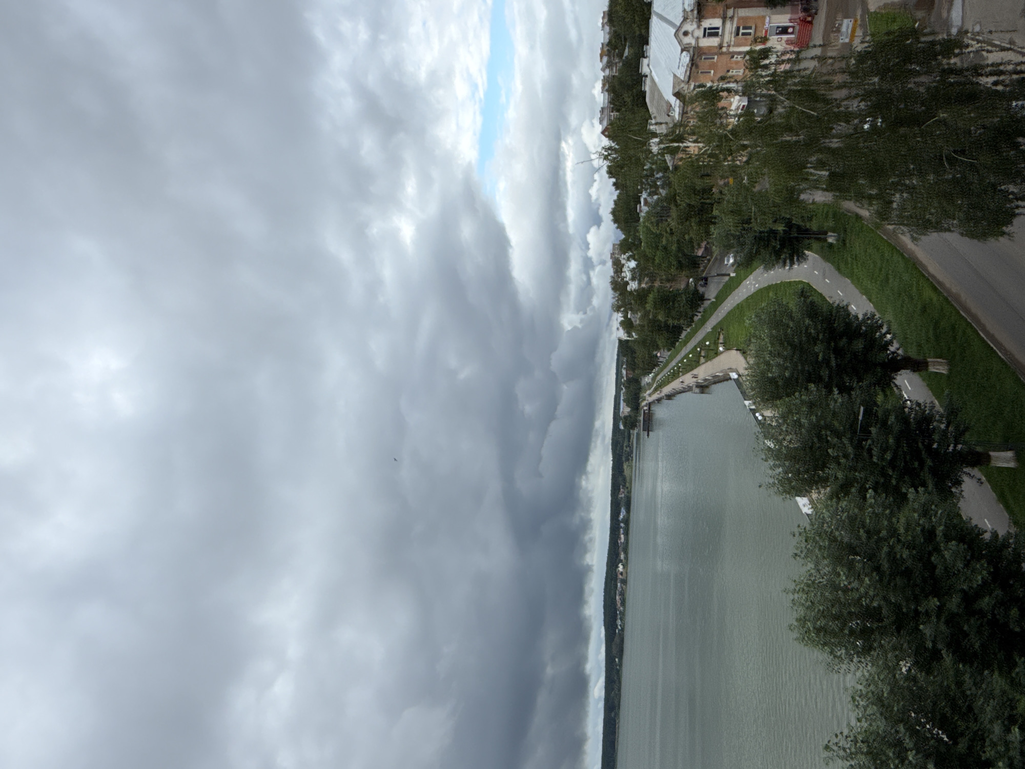 Aerial views of Votkinsk's calm lakefront under heavy overcast skies