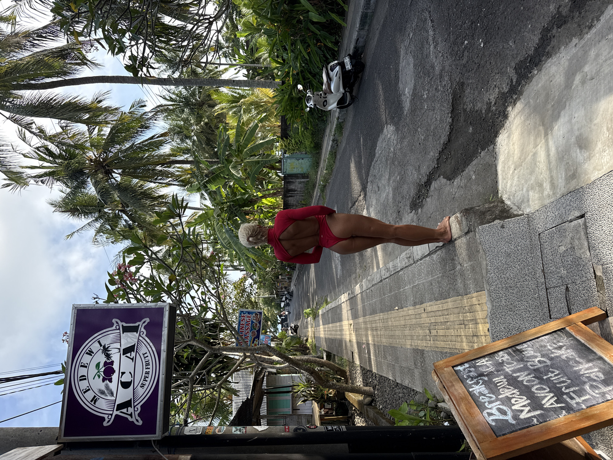 Tropical street scene with palm trees documented by witness