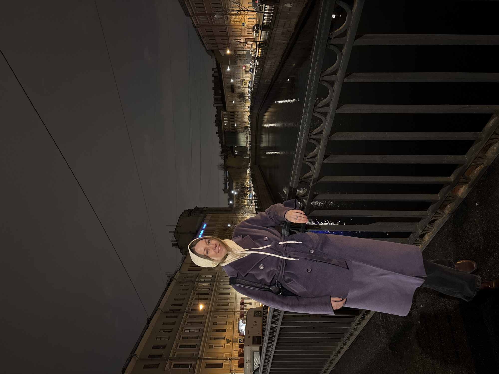 Woman in purple coat spotted on Saint Petersburg bridge