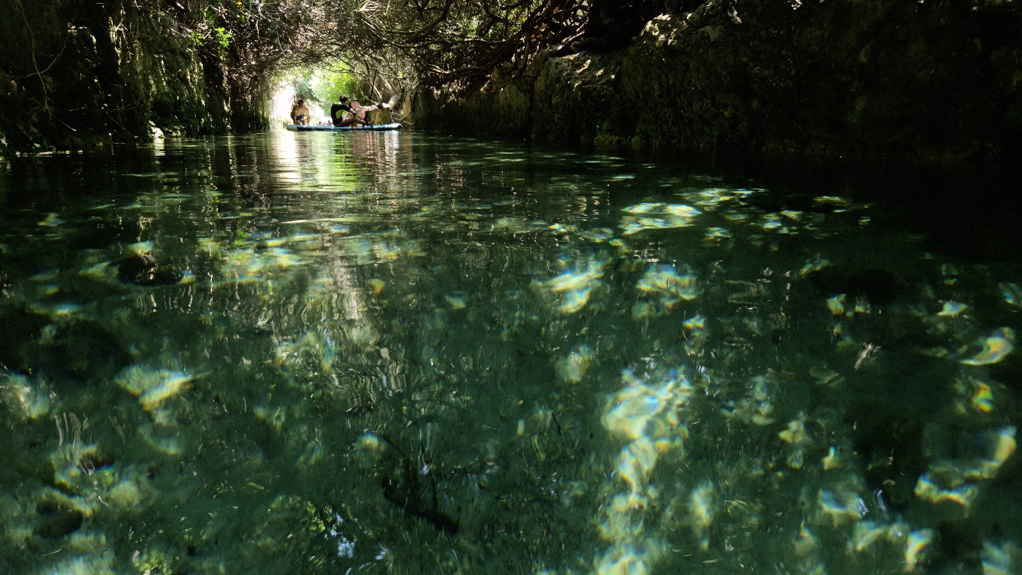 Clear green waters and rocky cliffs of Porto Cesareo