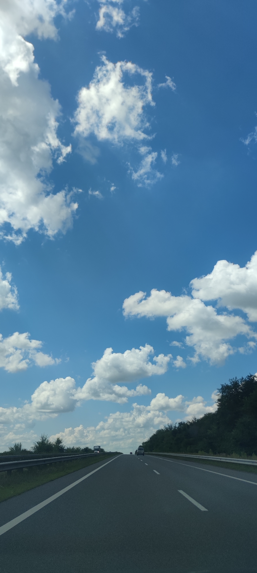 Open road views from a moving vehicle, clear skies