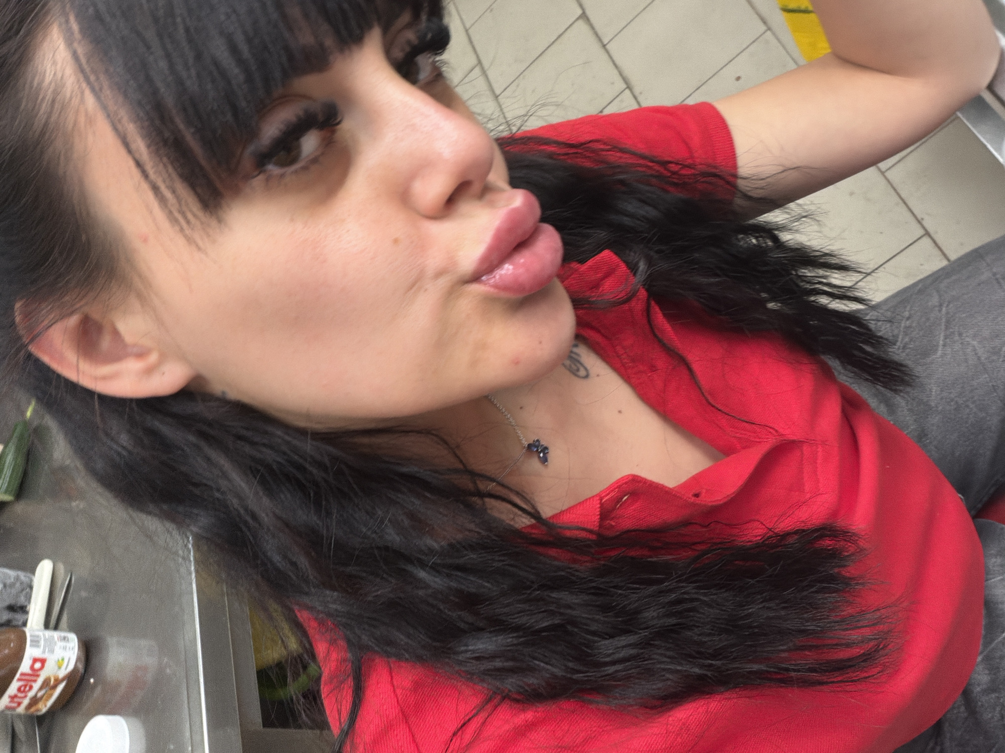 Selfie series in Plovdiv, red shirt and butterfly necklace.
