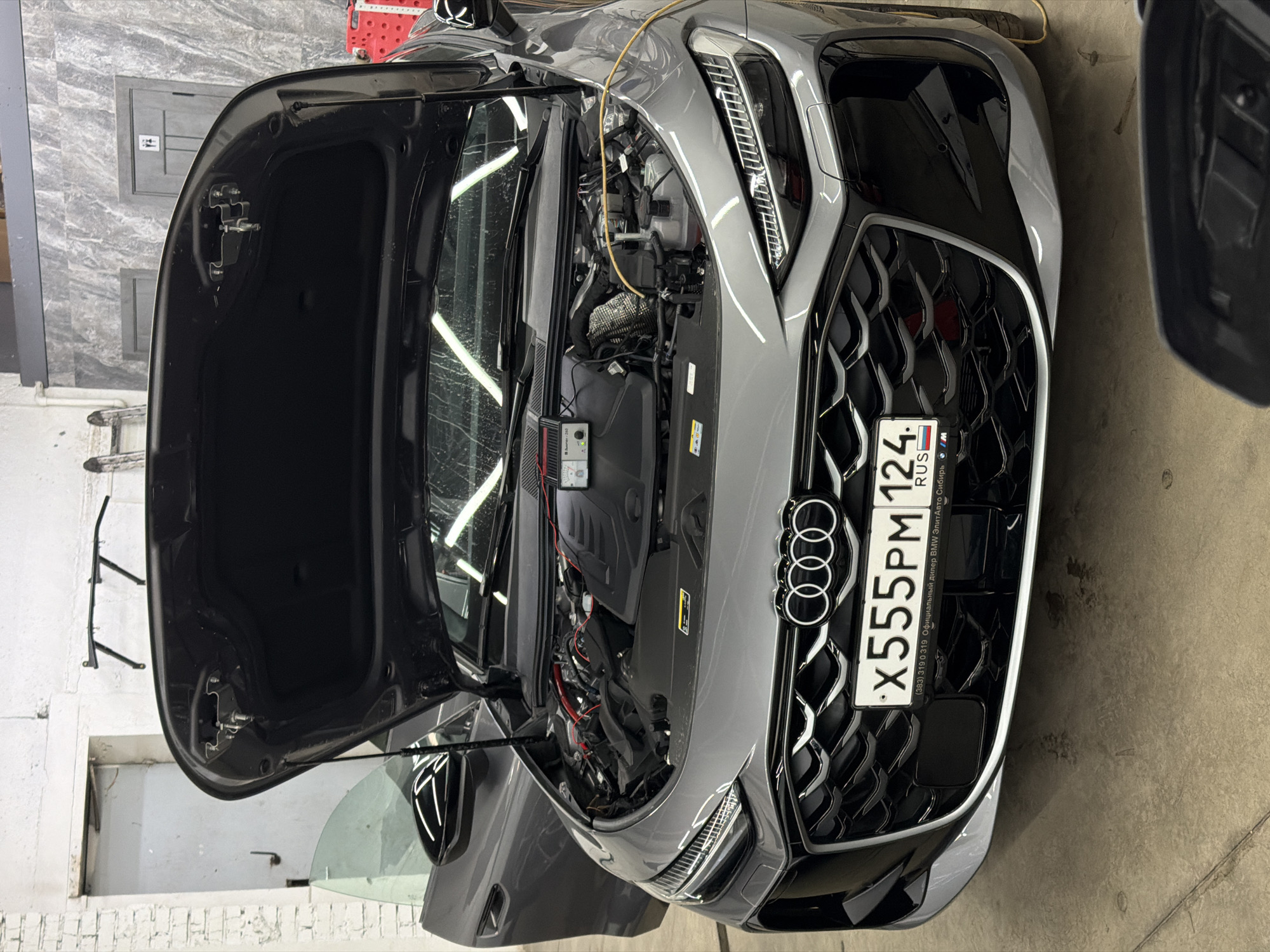 Car detailing session documented at Krasnoyarsk automotive shop