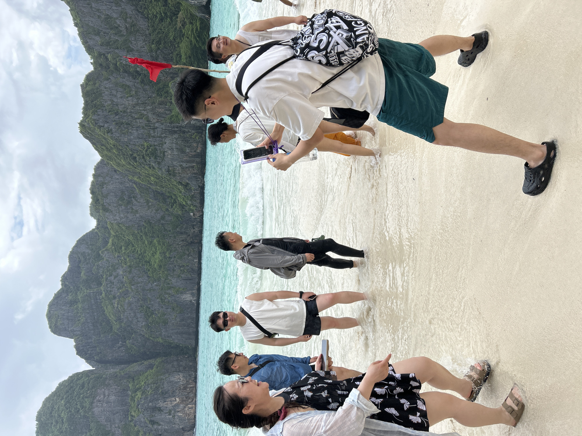 Beach guide directs tourists at Ao Nang Thailand
