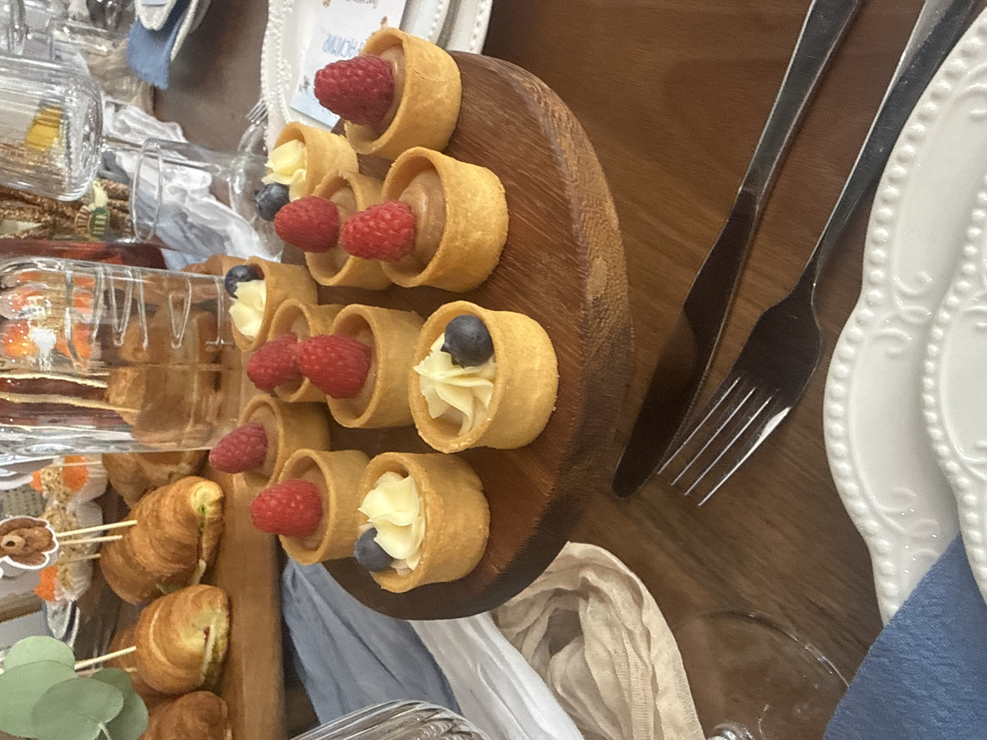 Baby shower table spread with pastries and floral decor, Sofia