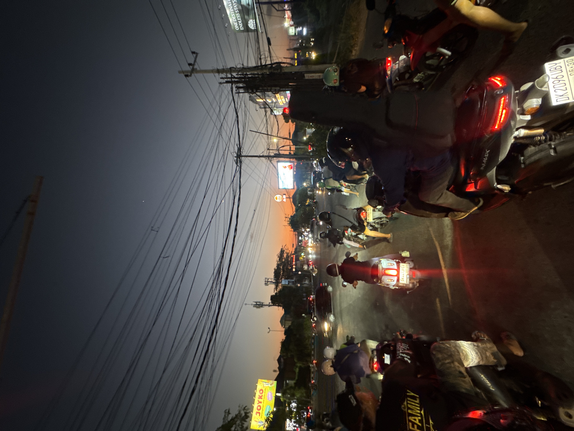 Kuta evening traffic under a vivid sunset sky