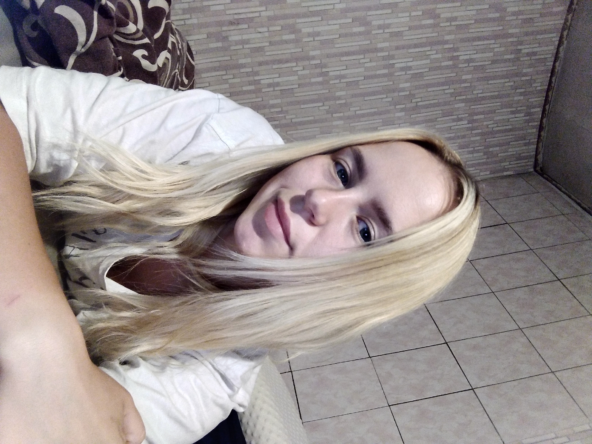 Casual selfie session in a tiled bedroom or bathroom