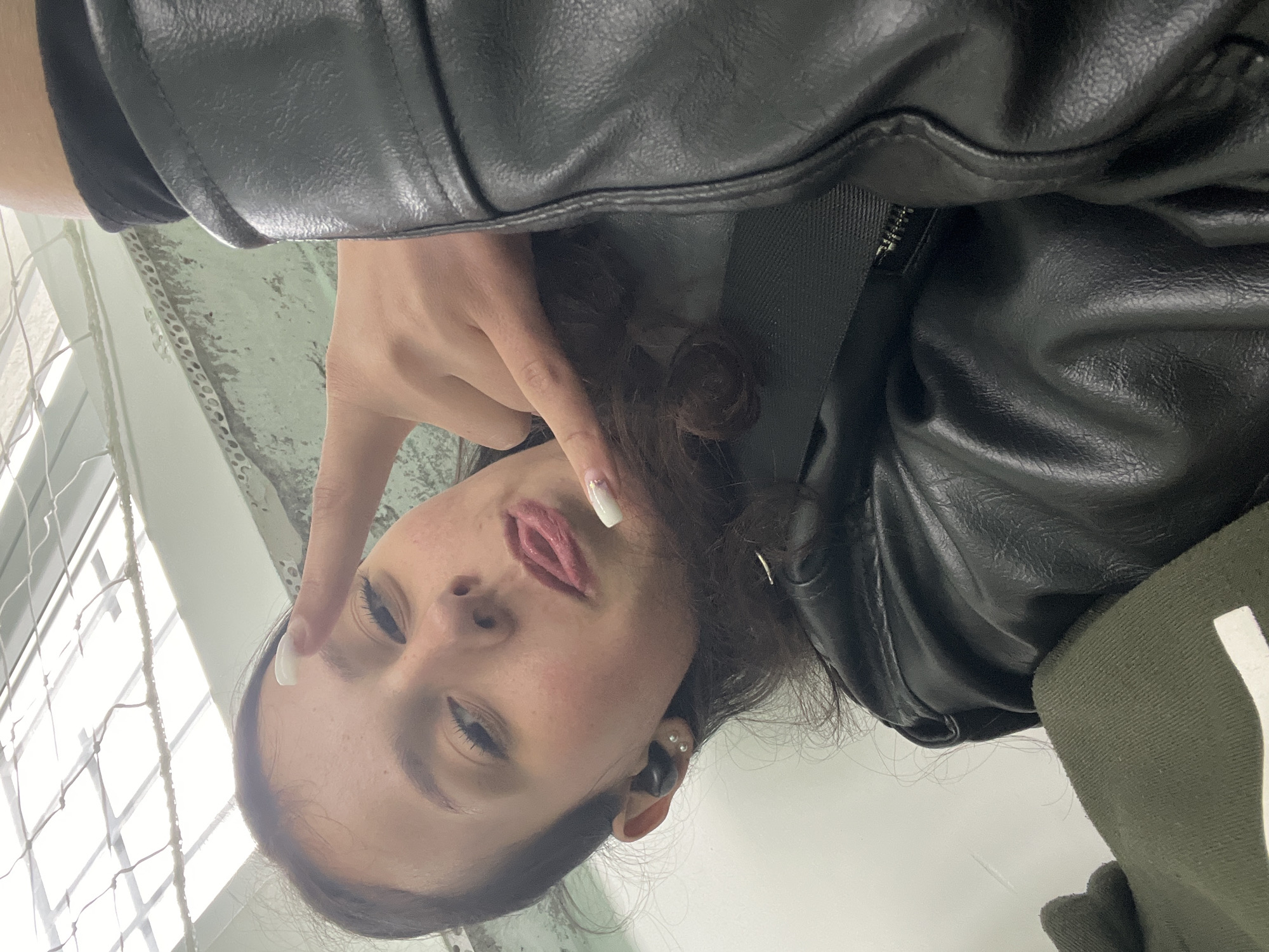 Woman takes indoor selfies in Karnobat, Bulgaria