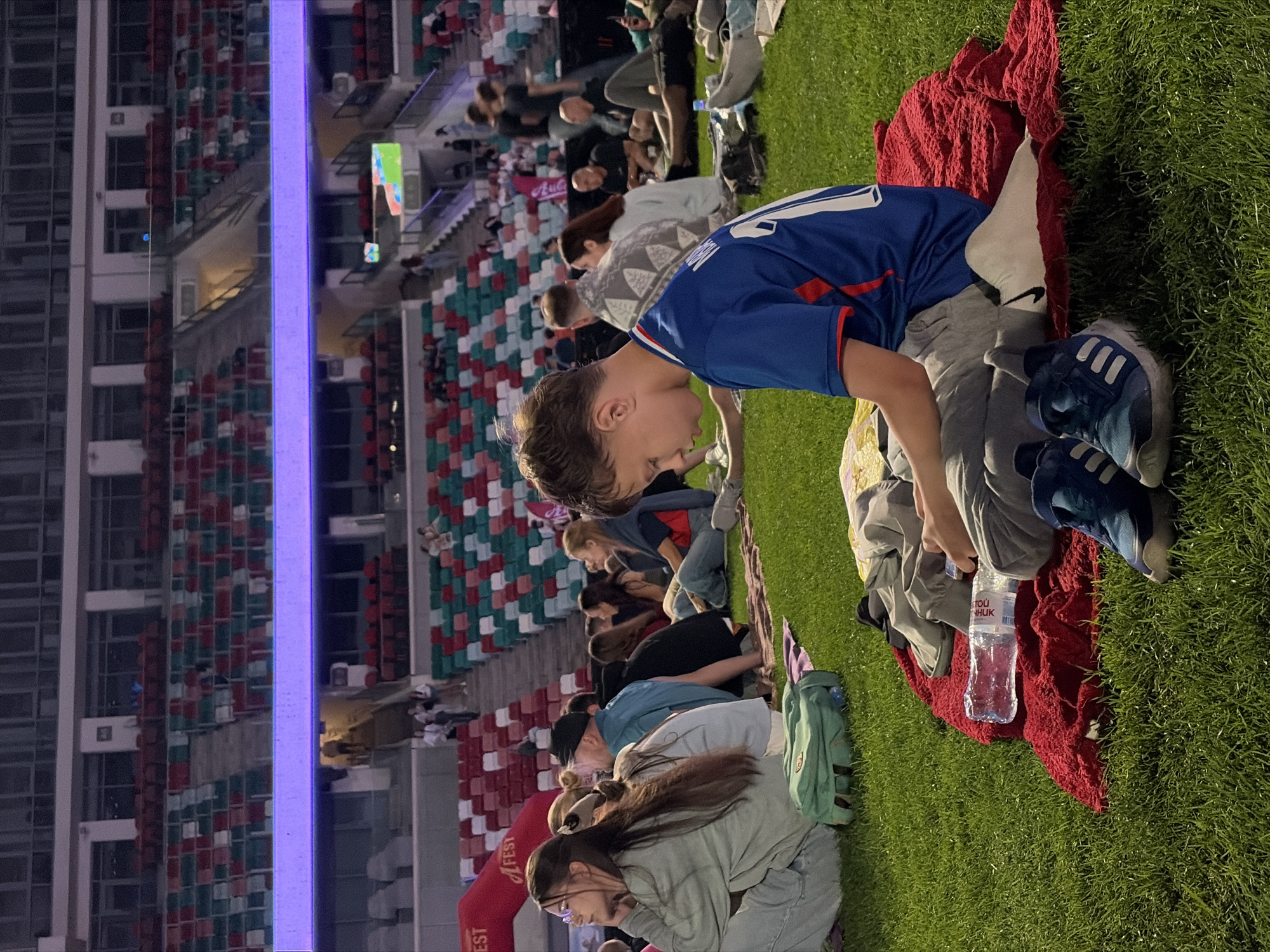 Crowd gathers at Dinamo Stadium for live football broadcast