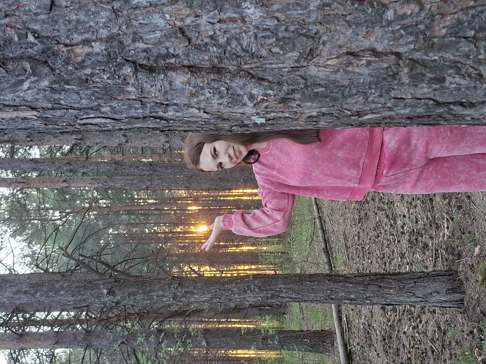 Woman jogs, takes selfies in Chaikovsky forest during afternoon