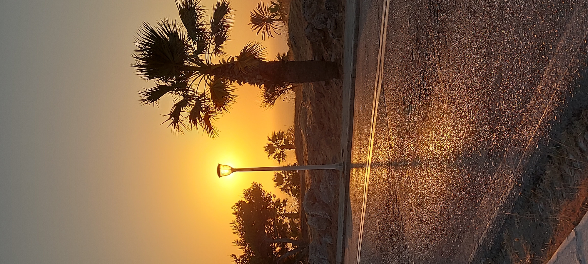 Streetlamp silhouette at sunset, Rhodes roadside