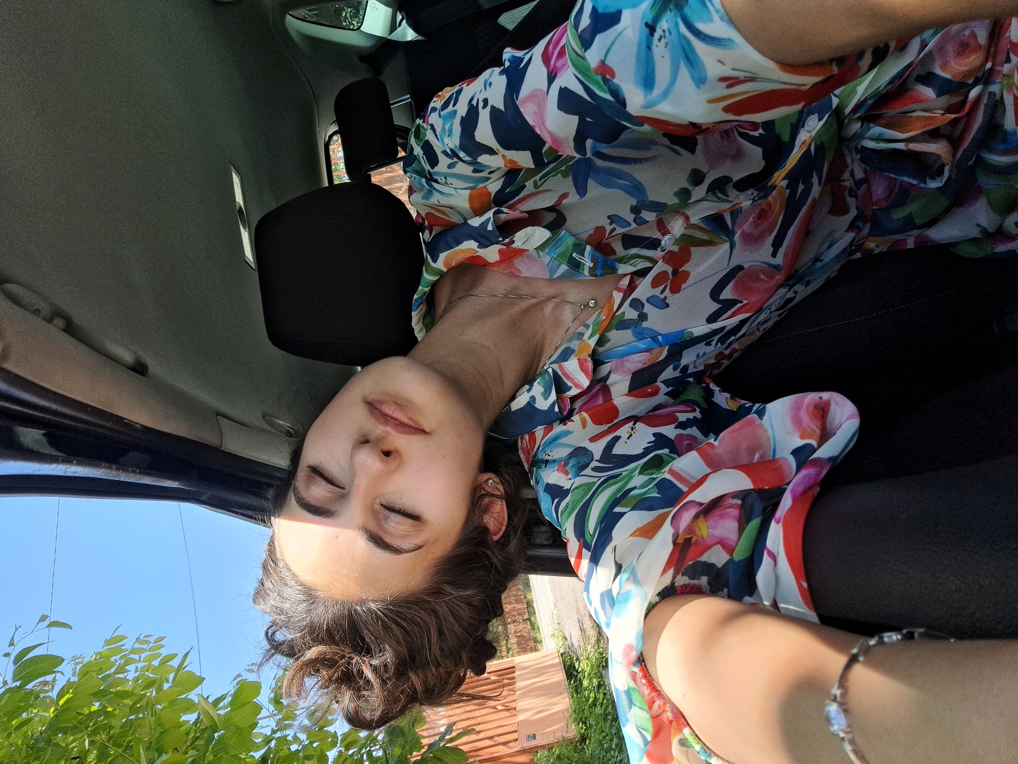 Woman photographed in car during brief morning moment in Sofia