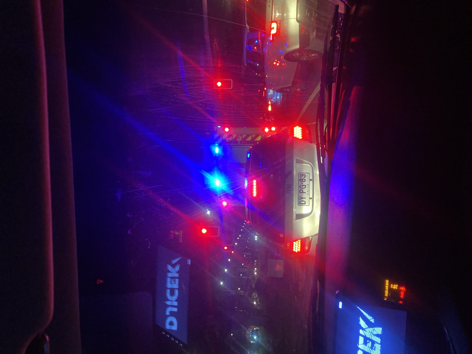 Emergency vehicle conducts nighttime traffic stop in Arica, Chile