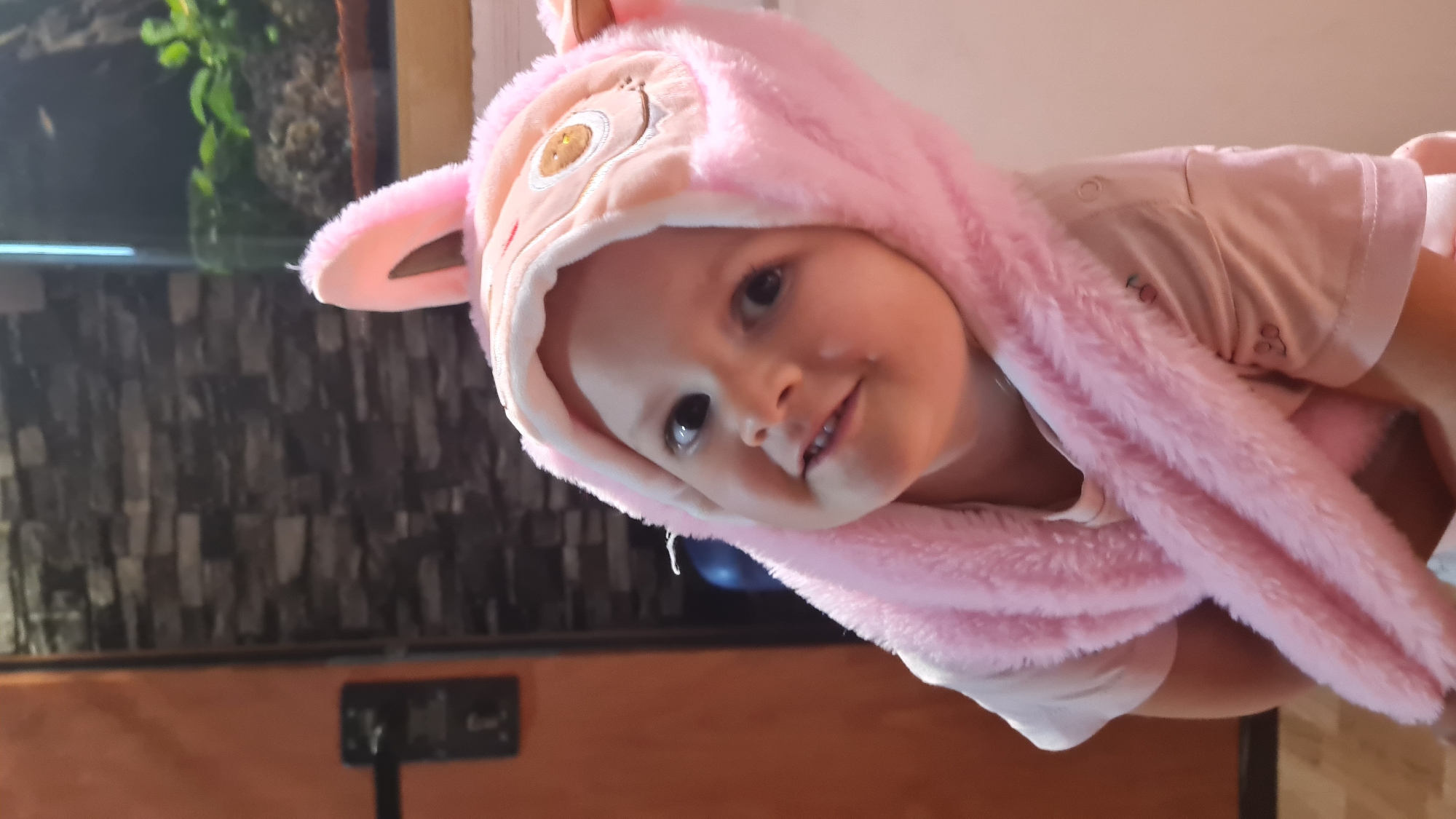 Child in pink bunny outfit photographed in Israel