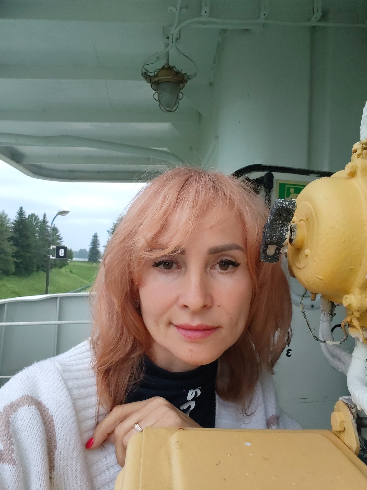 Vessel navigates a river lock system in Belousovo, Russia
