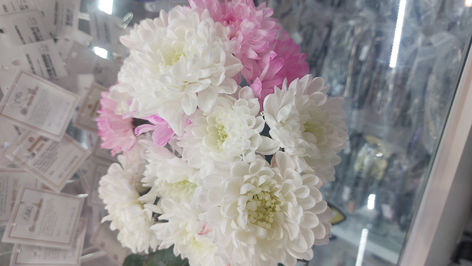 Chrysanthemum bouquet displayed in Novosibirsk retail setting