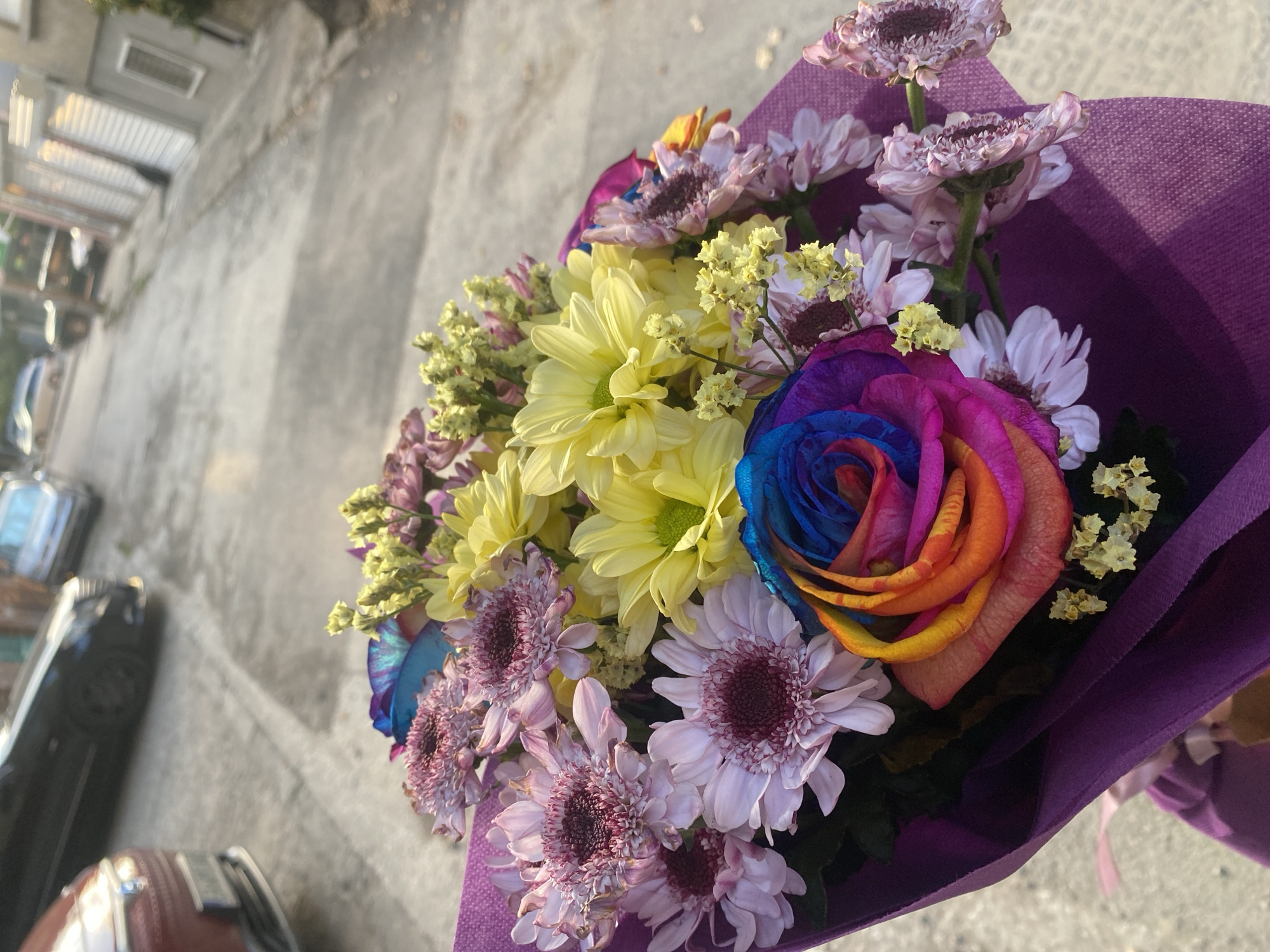 Flower bouquets and a moonlit city sky, same evening