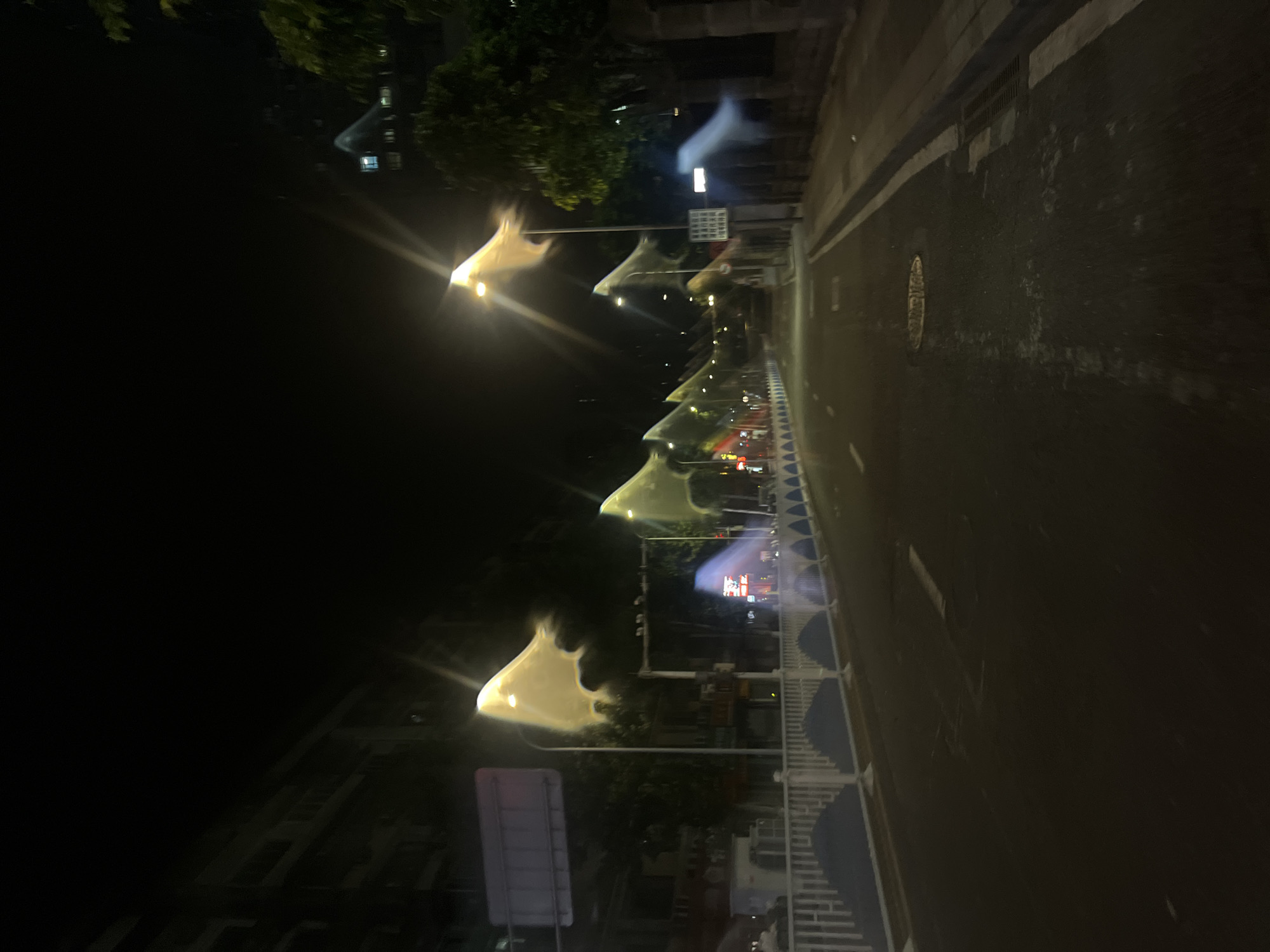 Nighttime street scenes captured across two Chongqing districts