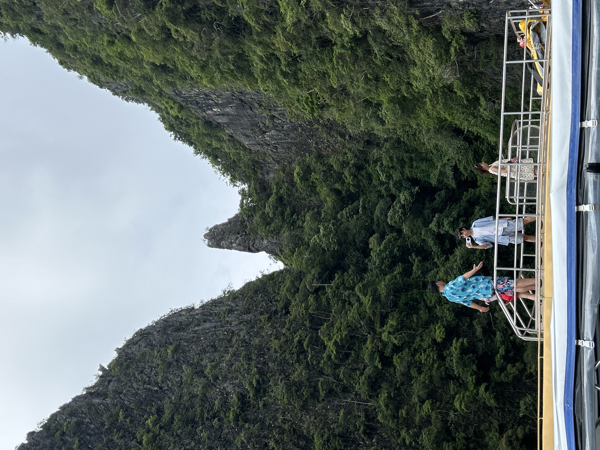 Boat navigating between limestone cliffs in Ao Nang