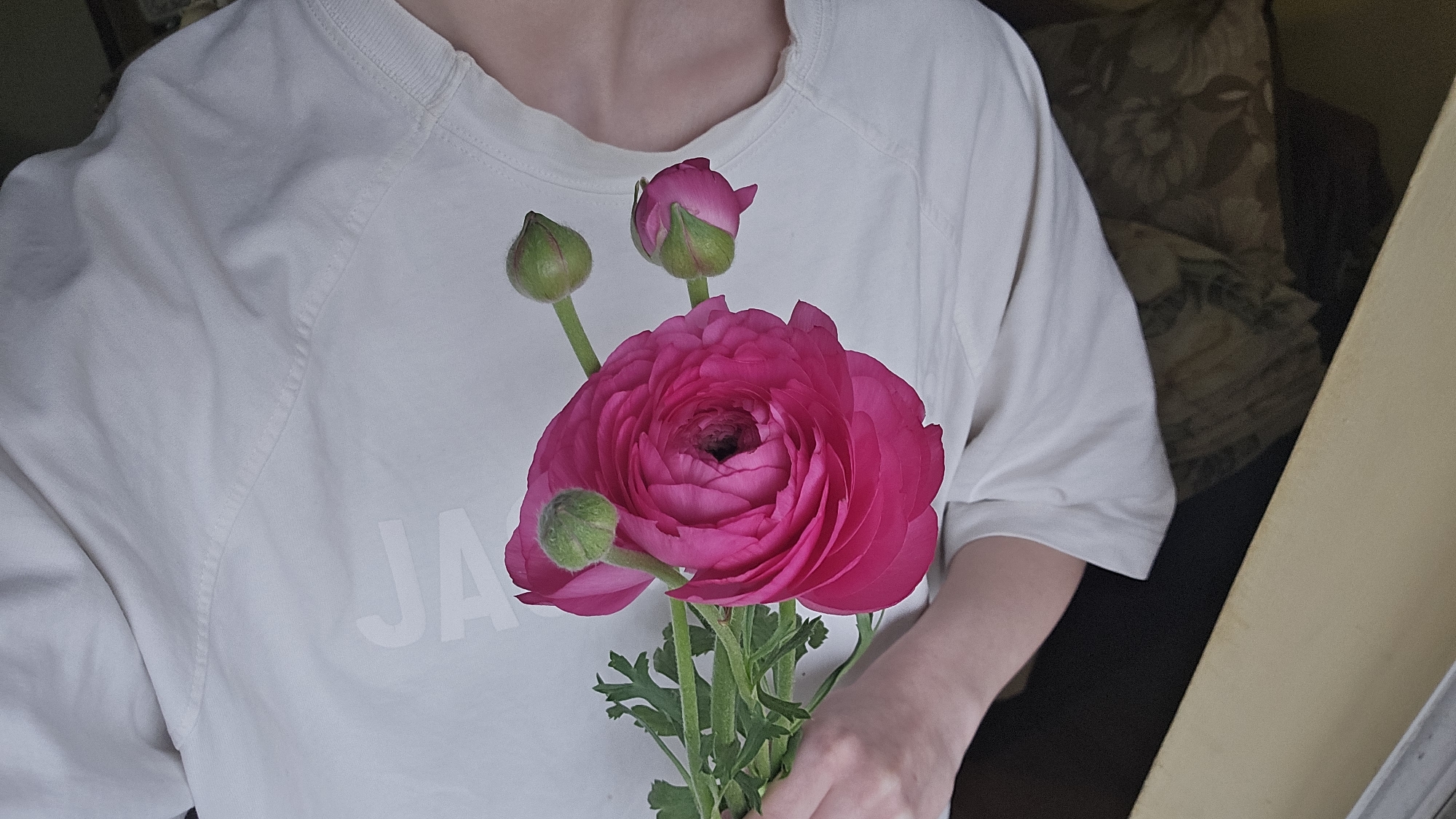 Woman captures morning selfies with flowers and coffee in Bulgaria