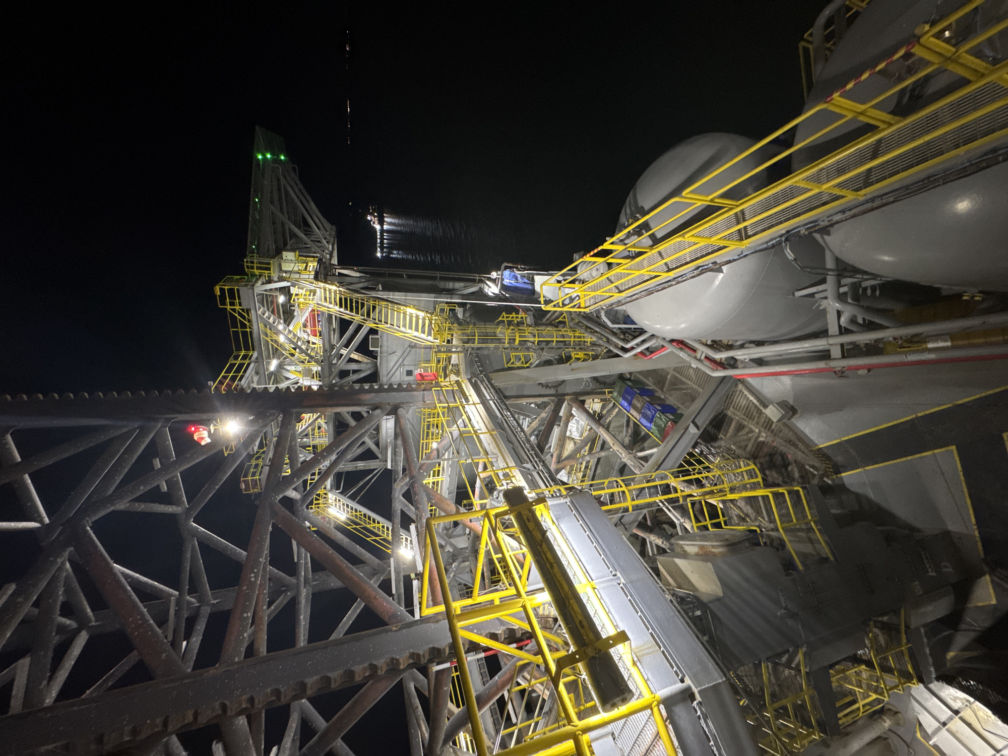 Industrial facility illuminated at night in Italy