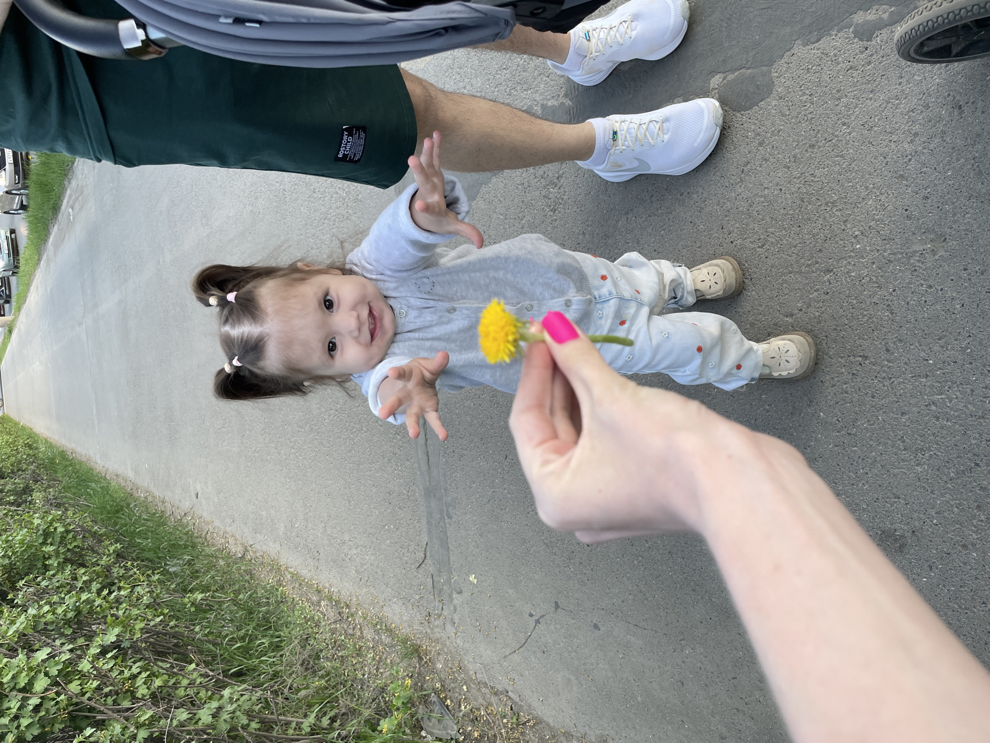 Woman and child share dandelion moment in Izhevsk