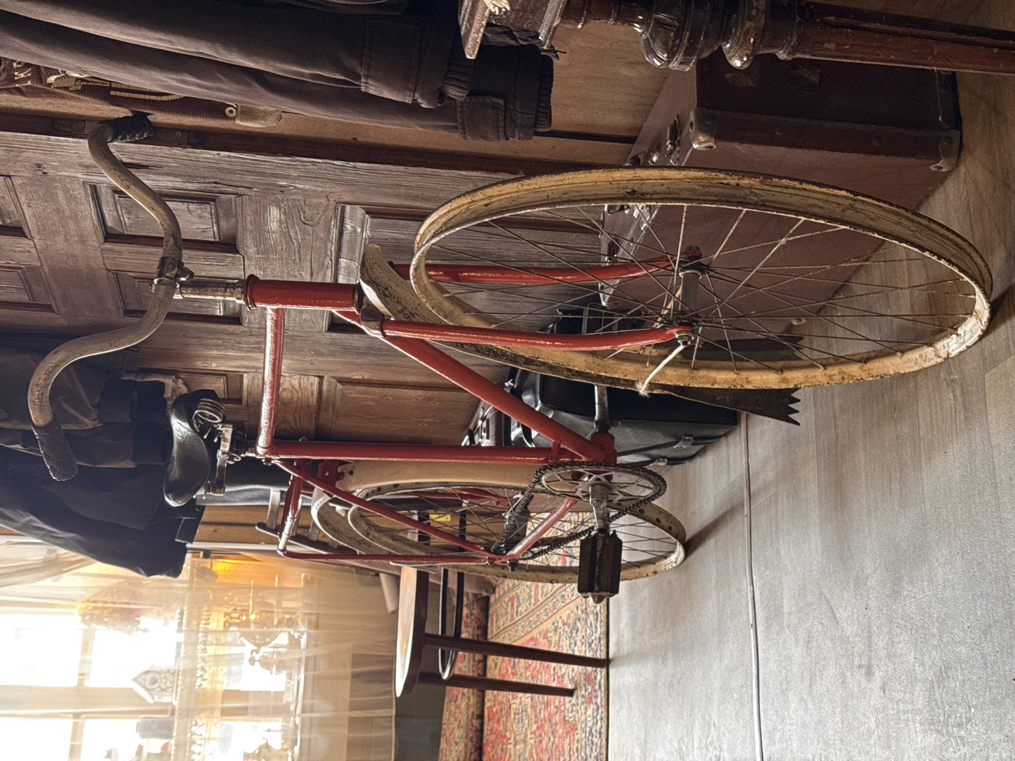 Morning scenes in Kladovitsy: vintage bicycle, sparrow on weathered wood