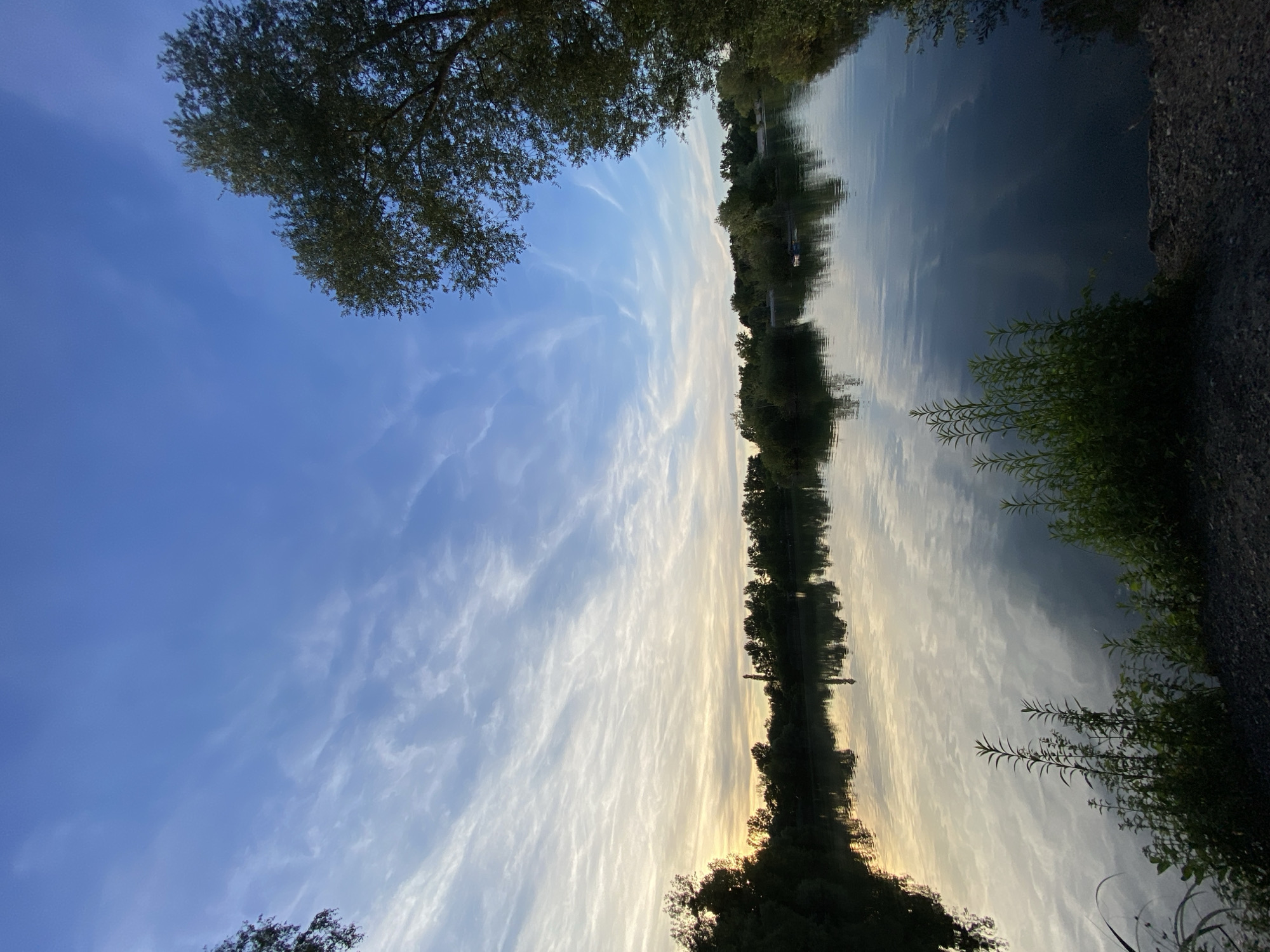 Sunset over a calm lake in Hœnheim, France