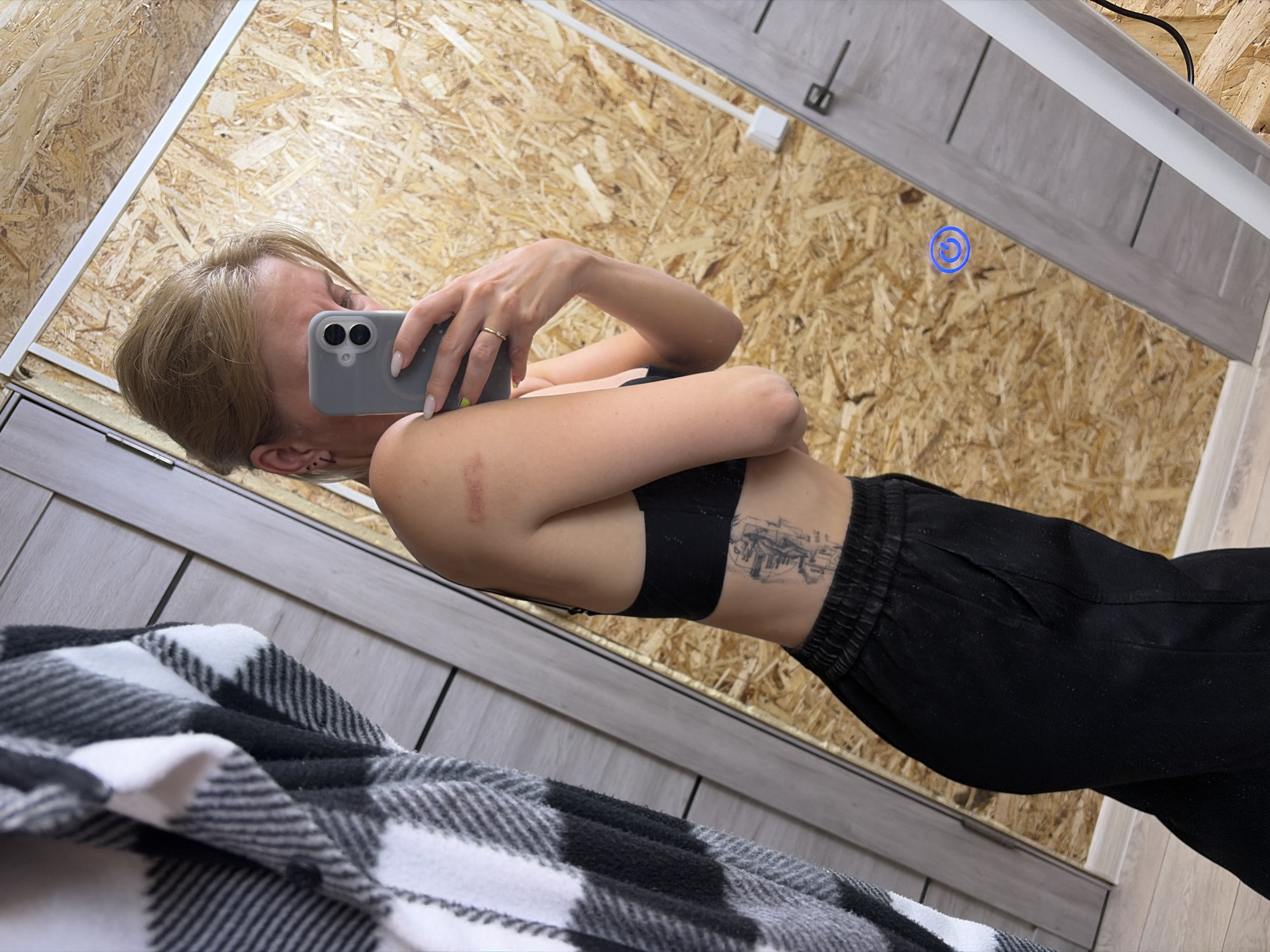 Person takes selfie in fitting room, Chaikovsky, Russia
