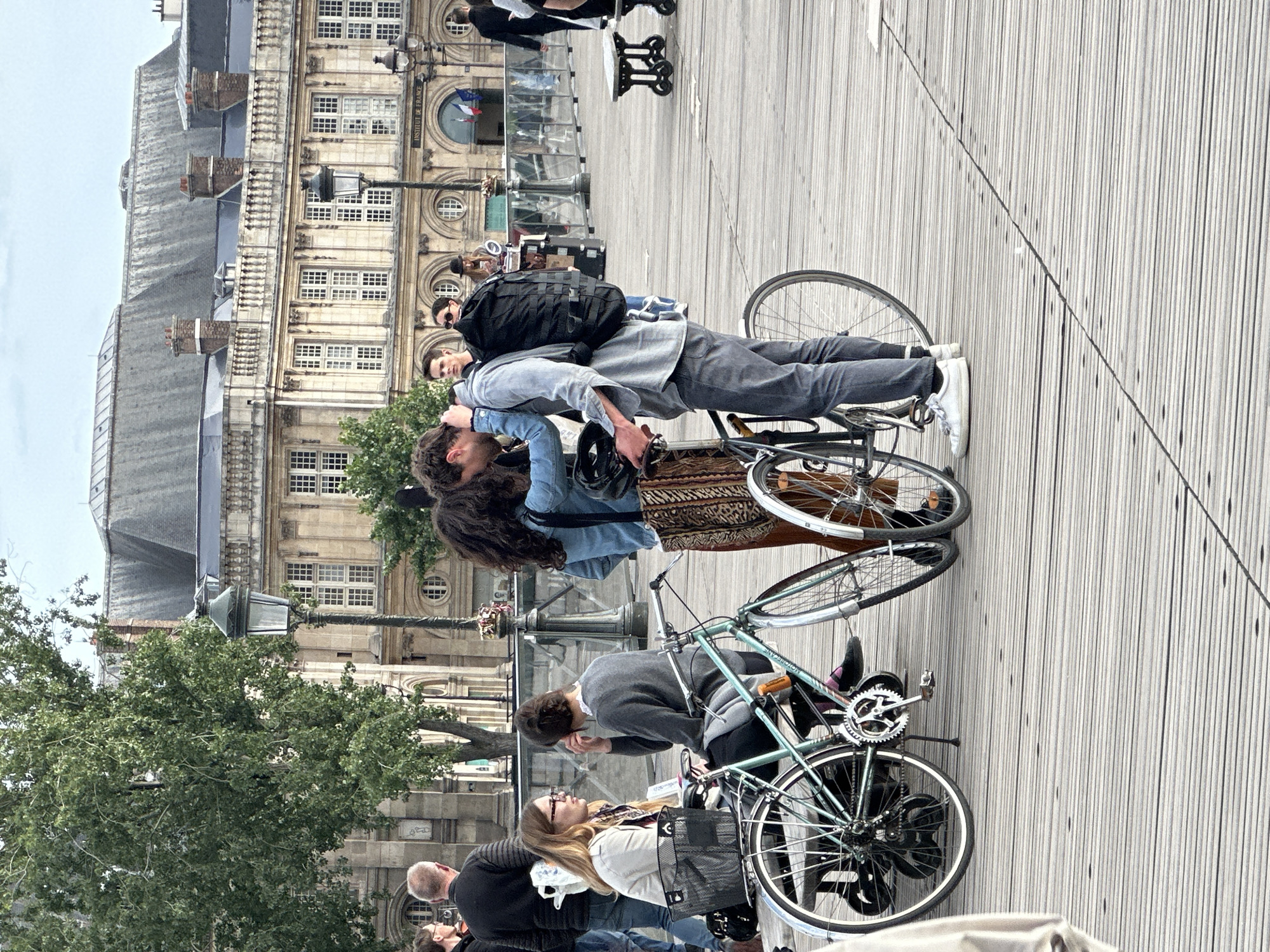 Parisians and tourists enjoy typical evening activities along Seine River
