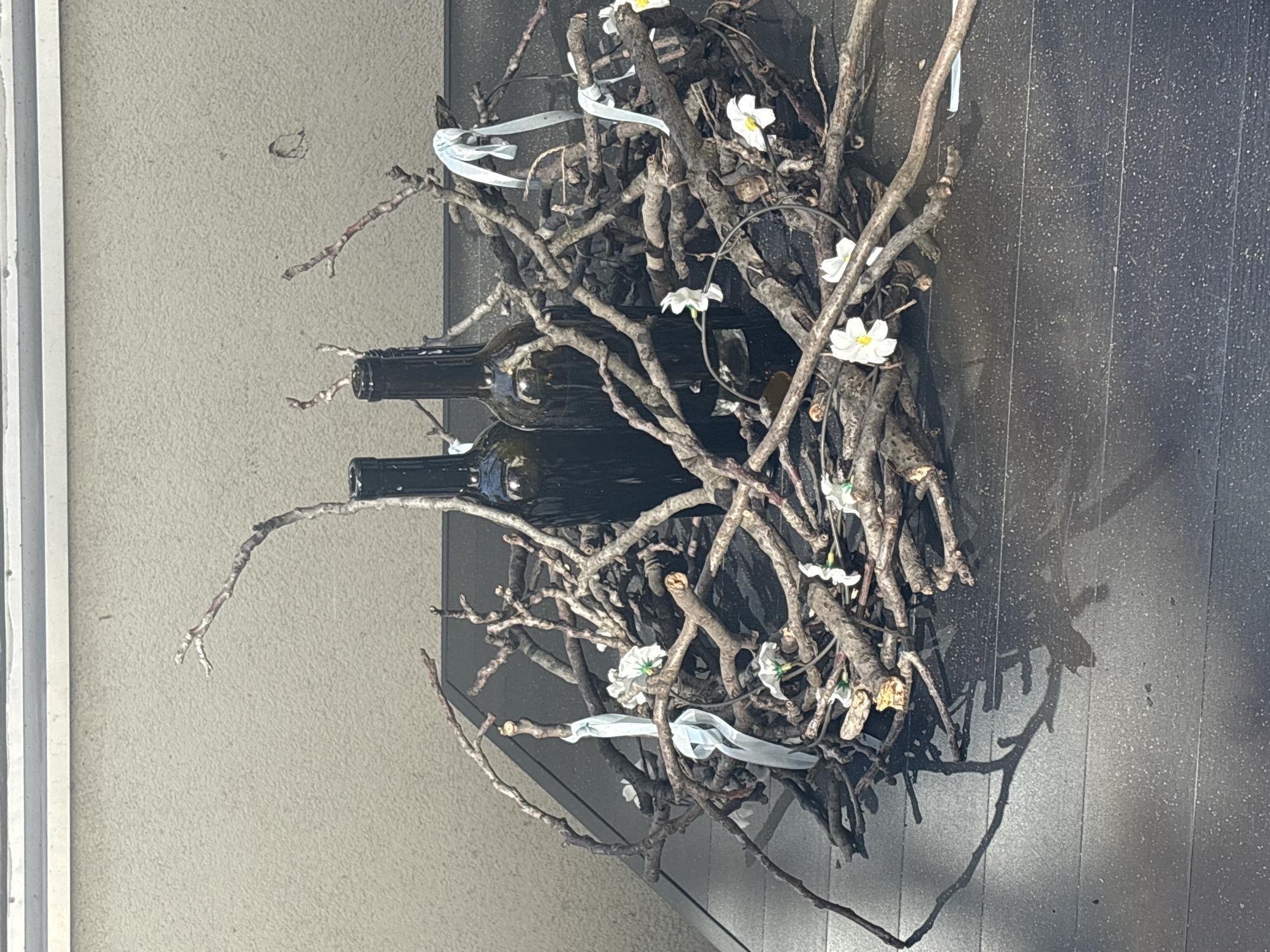 Wine rack and flowering tree documented in afternoon observations