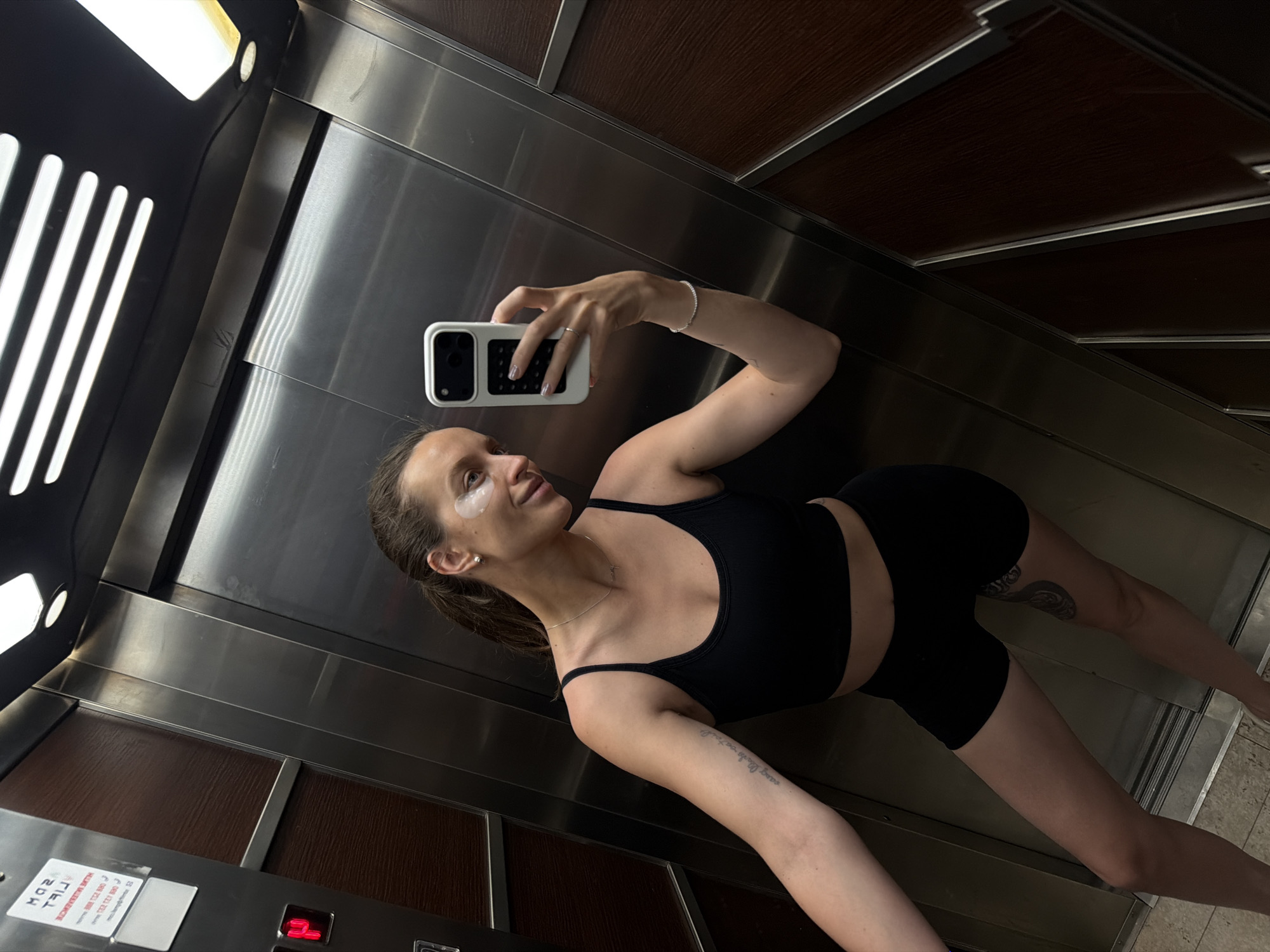 Woman Takes Elevator Selfies in Budva Wearing Athletic Wear