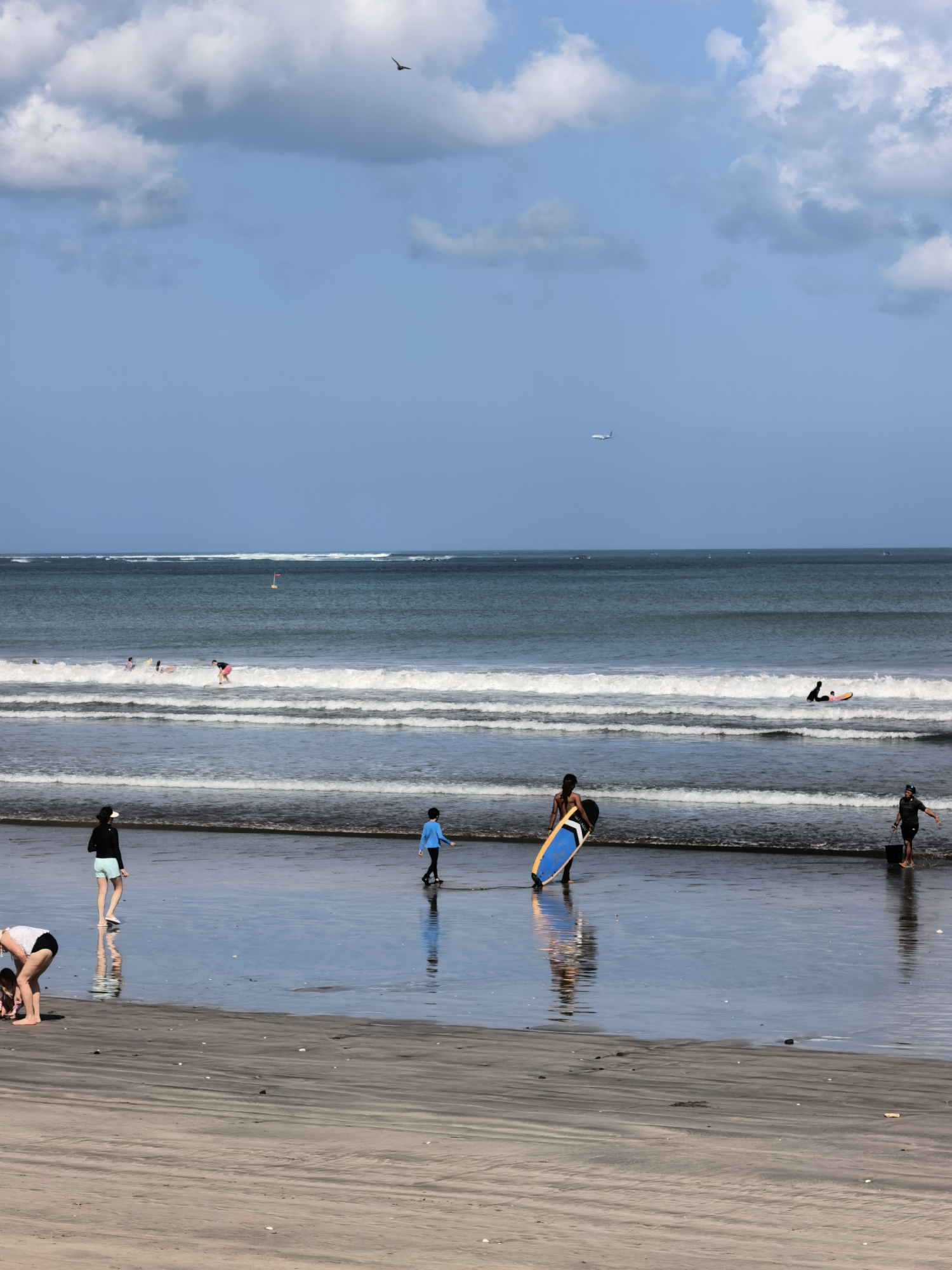 Kuta beach and Uniqlo retail browsing on a July morning