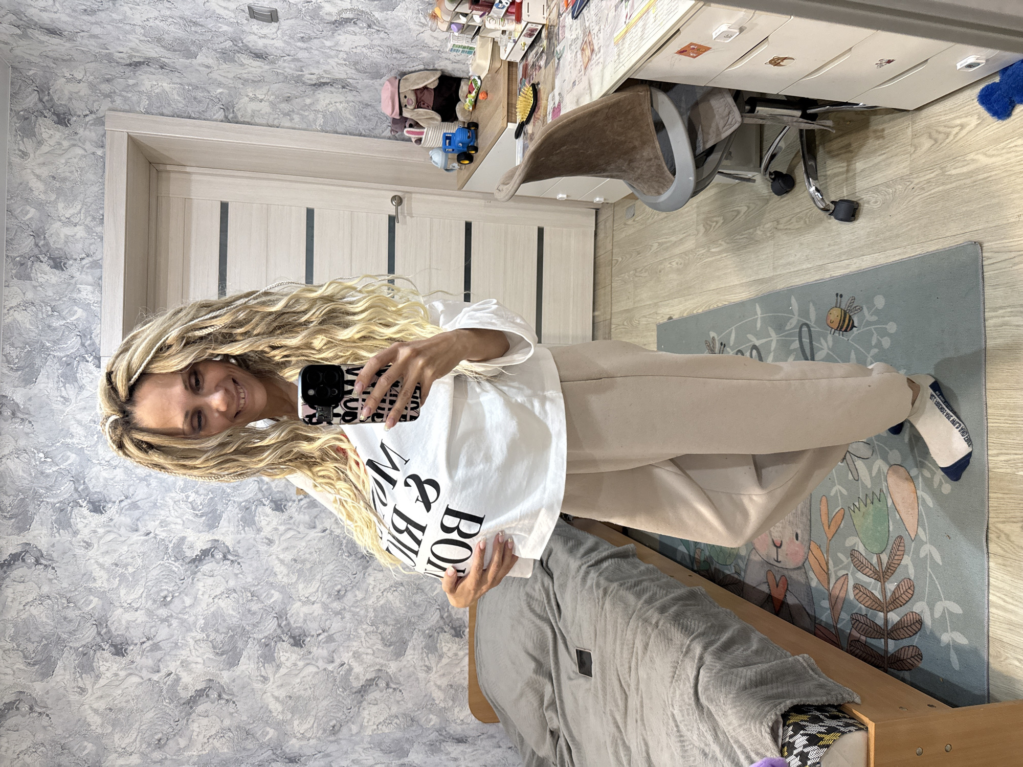 Woman takes mirror selfie in Rusanovo, Russia