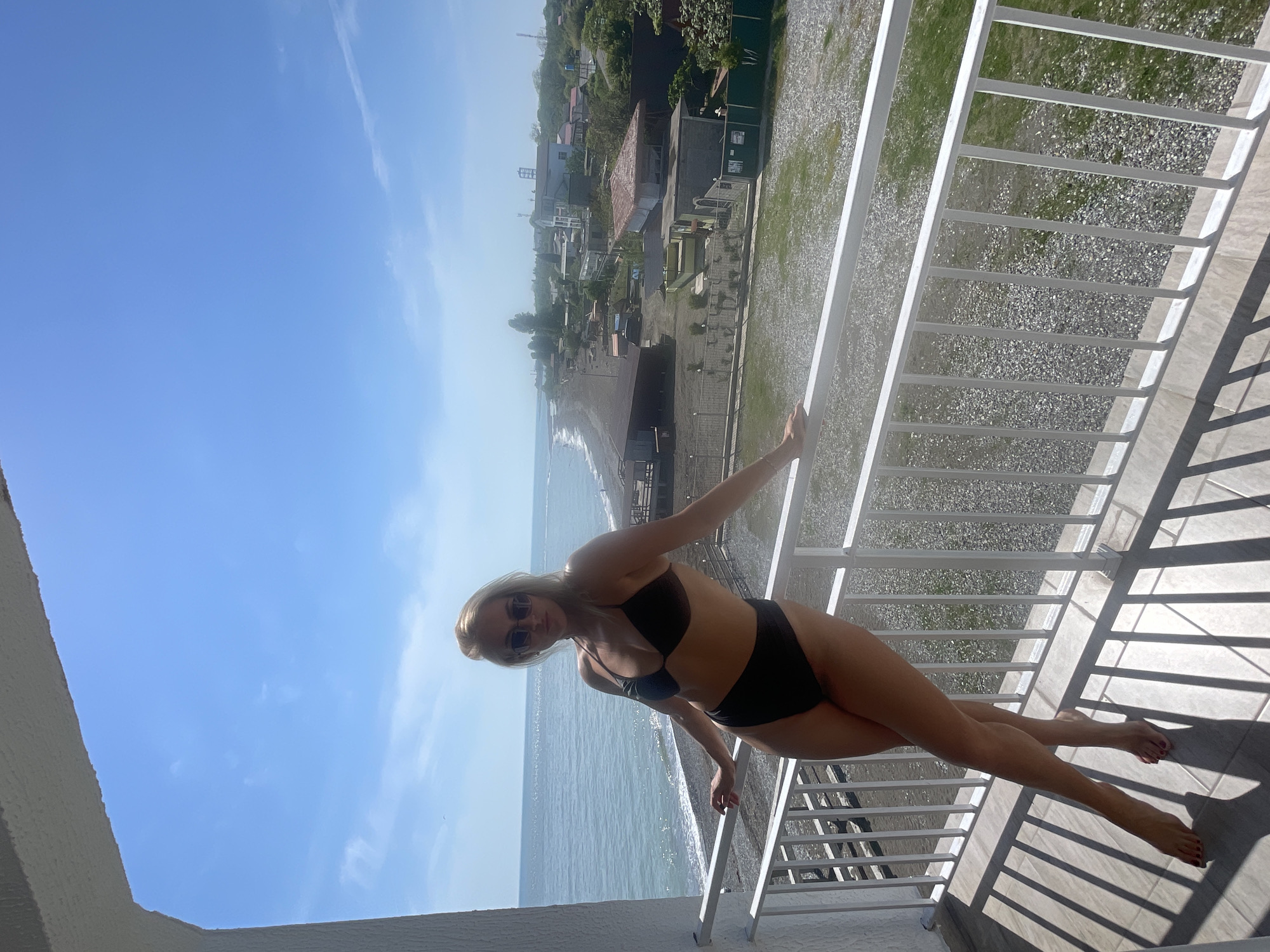Woman enjoys Black Sea balcony view in Giachrypsh