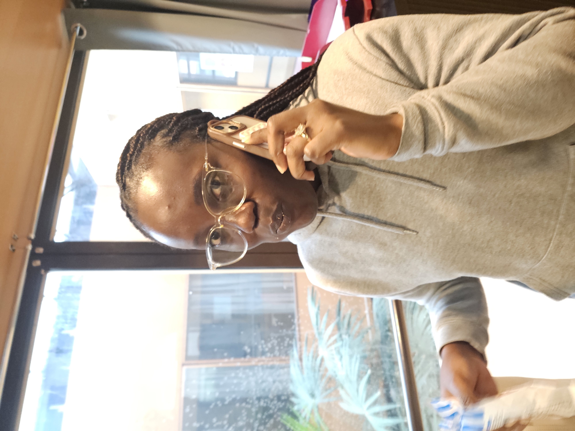 Woman makes phone call in Paris morning