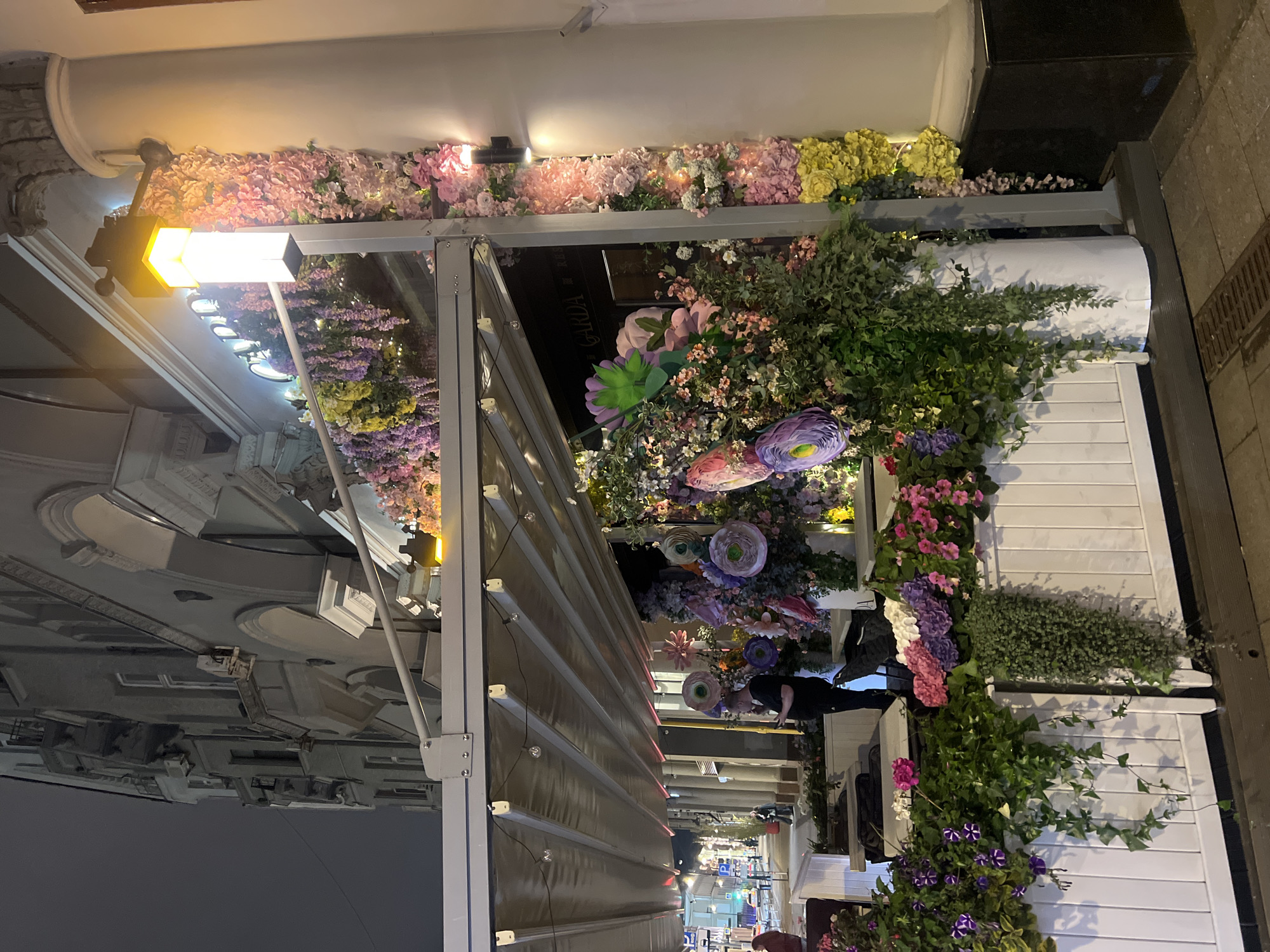 Moscow evening scenes show illuminated architecture, decorated restaurant entrance