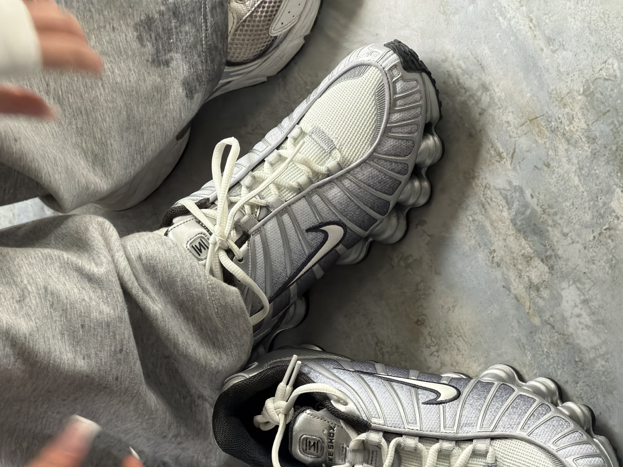 Woman documents athletic shoe selection across Armenia locations