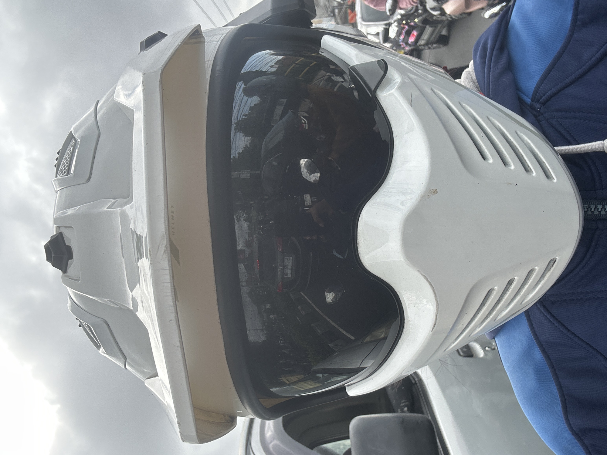 Helmet close-up and motorcycle gridlock in Denpasar