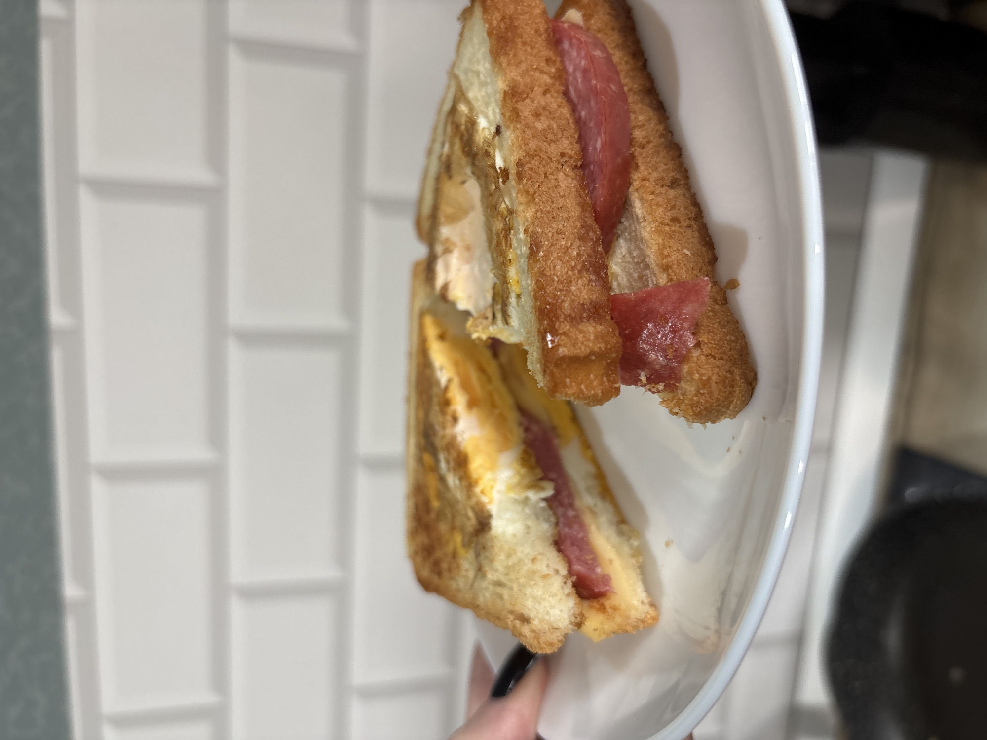 Egg and salami sandwich photographed in Saint Petersburg kitchen