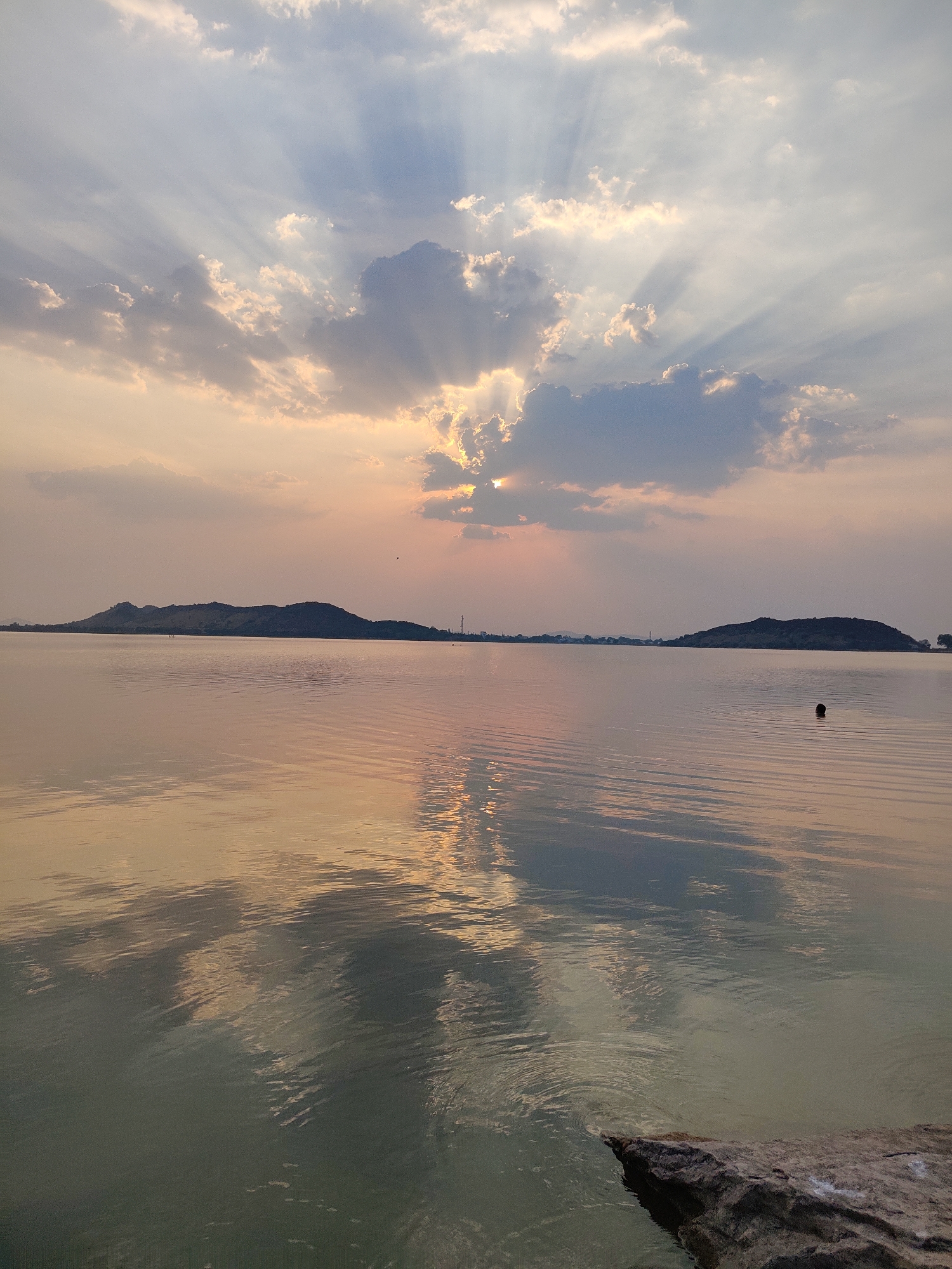 Sunset documented over lake in Kammavaripalli, India